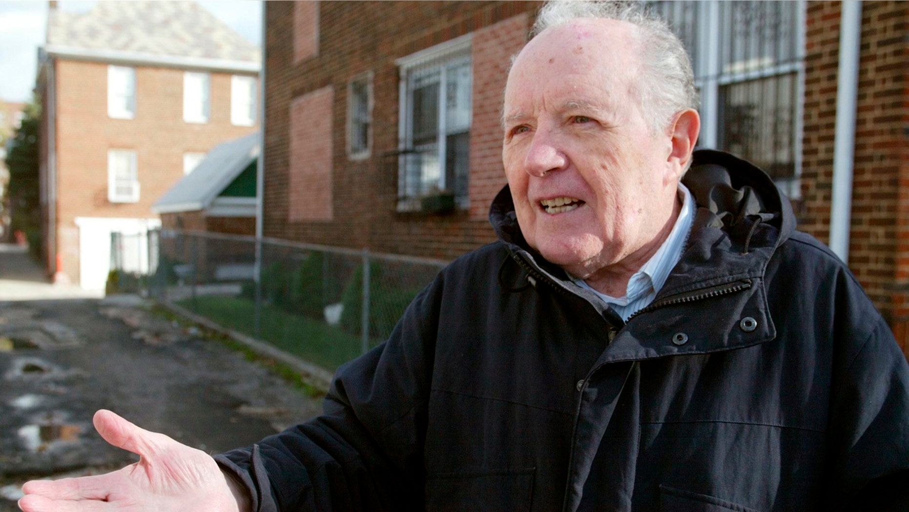 FILE - In this Nov. 20, 2003 file photo, Jakiw Palij, a former Nazi concentration camp guard, stands in front of a building in the Queens borough of New York. (Suzanne DeChillo/The New York Times via AP, File)