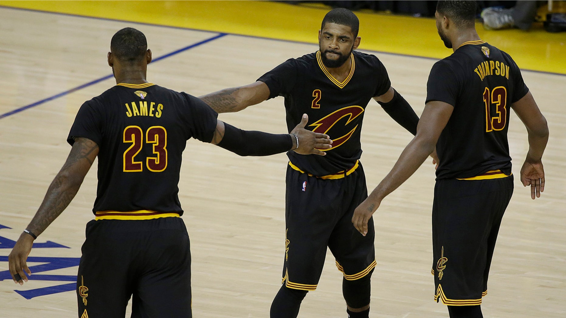 June 13, 2016: Cleveland Cavaliers guard Kyrie Irving (2), forward LeBron James (23) and center Tristan Thompson (13) react during the second half of Game 5 of the NBA Finals against the Golden State Warriors.