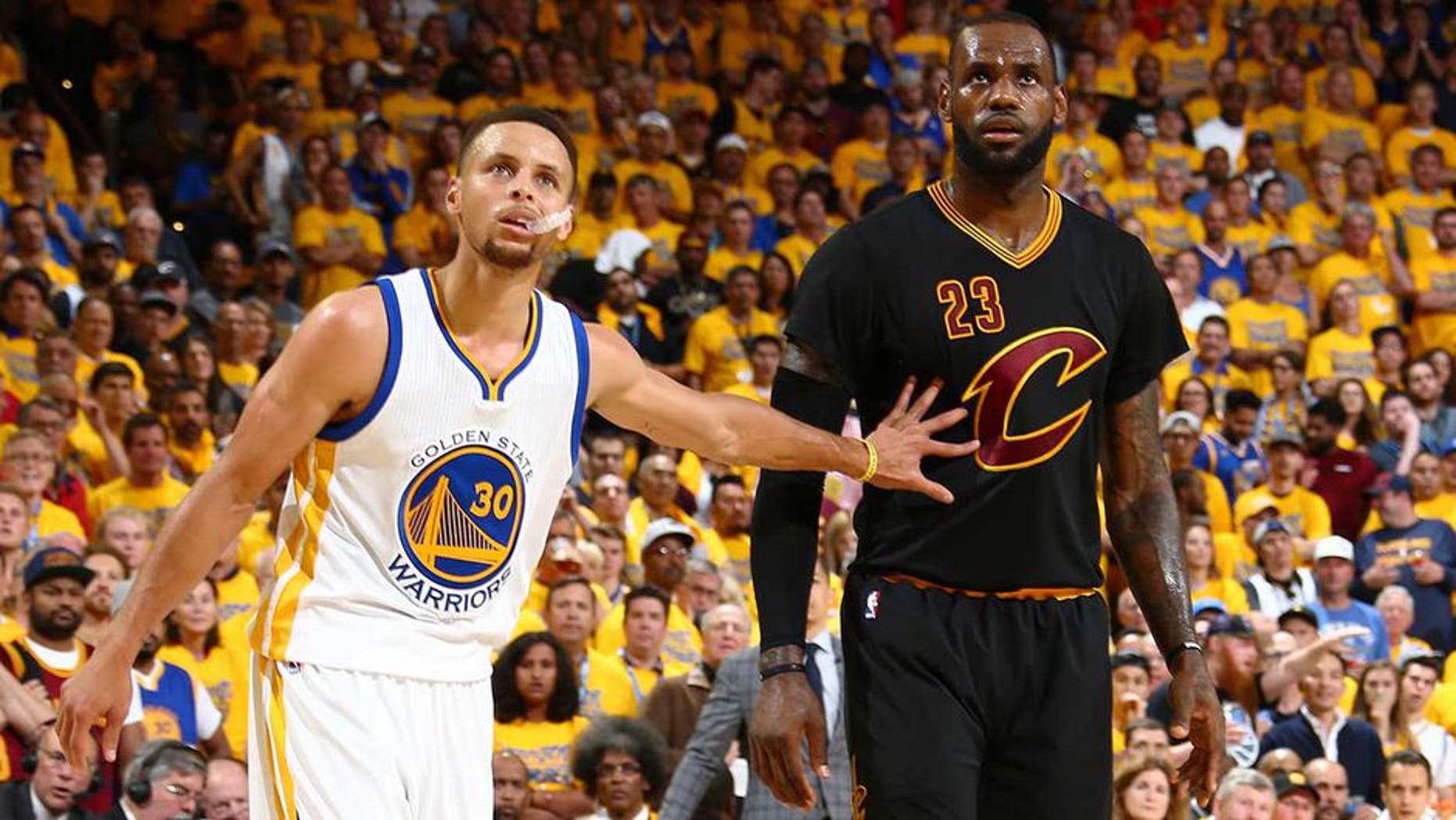 OAKLAND, CA - JUNE 19: Stephen Curry #30 of the Golden State Warriors and LeBron James #23 of the Cleveland Cavaliers during the game in Game Seven of the 2016 NBA Finals on June 19, 2016 at Oracle Arena in Oakland, California. NOTE TO USER: User expressly acknowledges and agrees that, by downloading and or using this photograph, user is consenting to the terms and conditions of Getty Images License Agreement. Mandatory Copyright Notice: Copyright 2016 NBAE (Photo by Nathaniel S. Butler/NBAE via Getty Images)