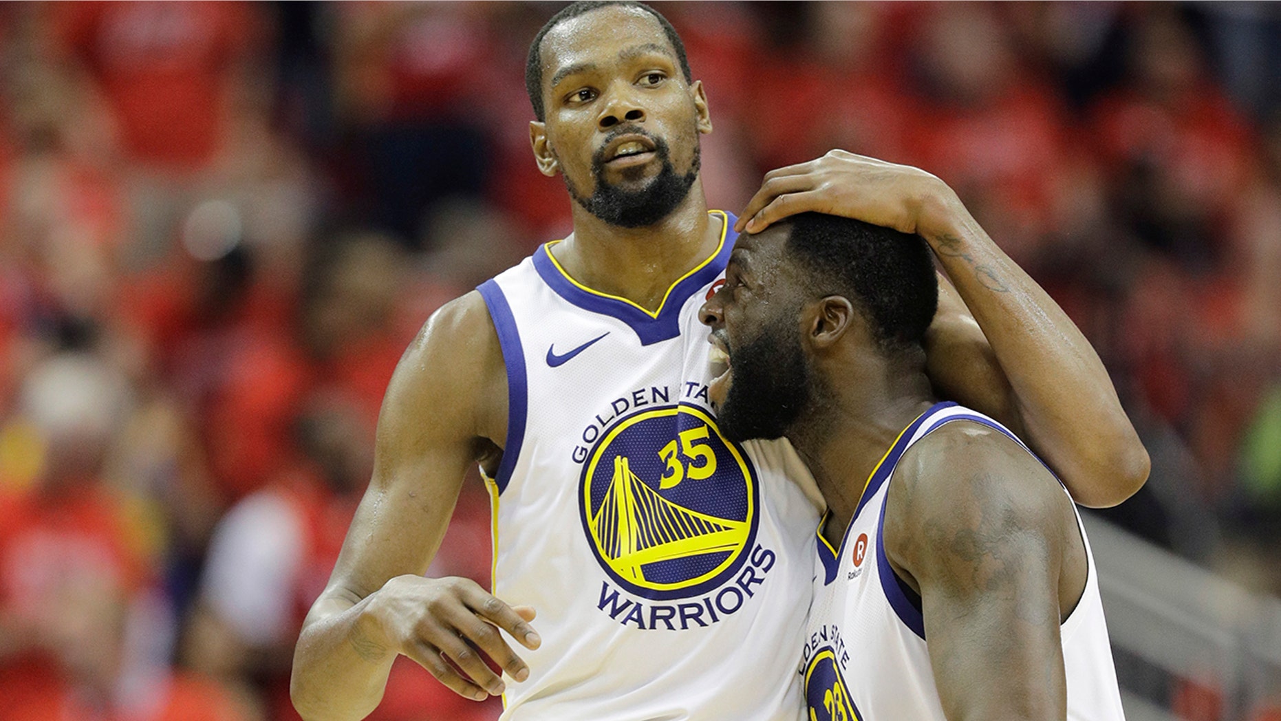 Golden State Warriors forward Kevin Durant (35) celebrates with teammate Draymond Green (23) during the second half in Game 7 of the NBA basketball Western Conference finals against the Houston Rockets, Monday, May 28, 2018, in Houston.