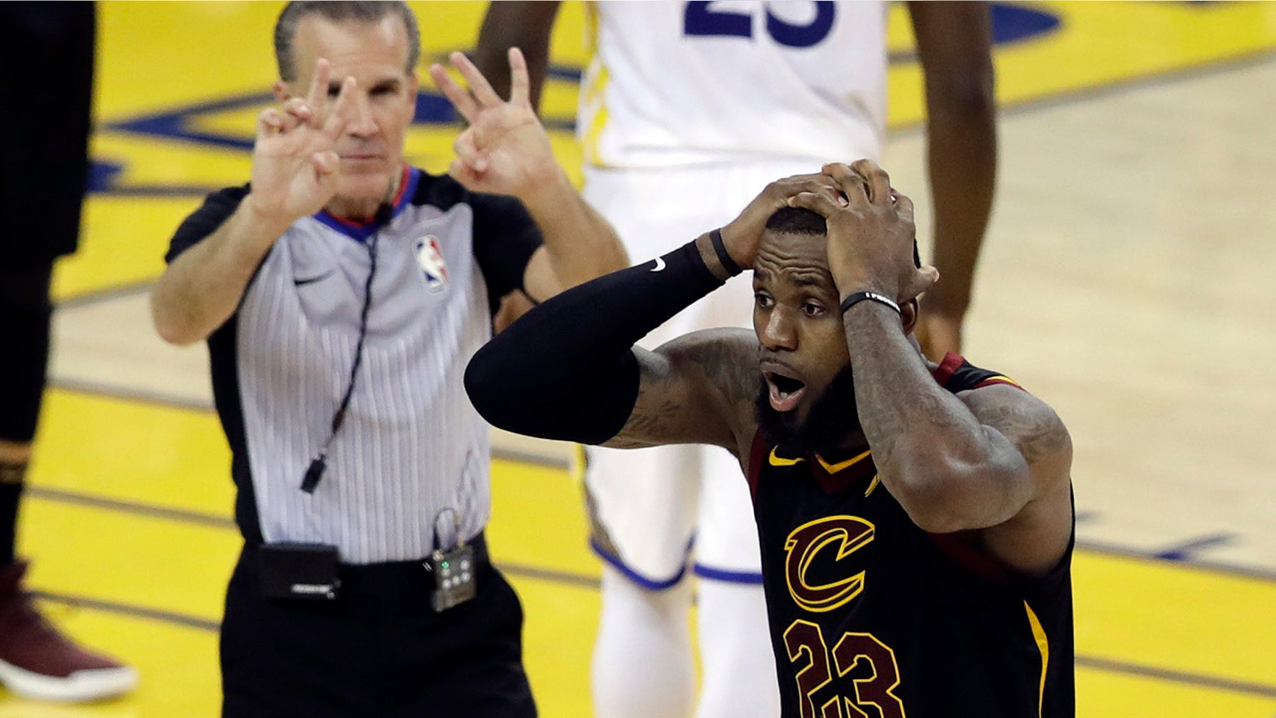 Cleveland Cavaliers forward LeBron James (23) reacts to a call during the second half of Game 1 of basketball's NBA Finals between the Golden State Warriors and the Cavaliers in Oakland, Calif.