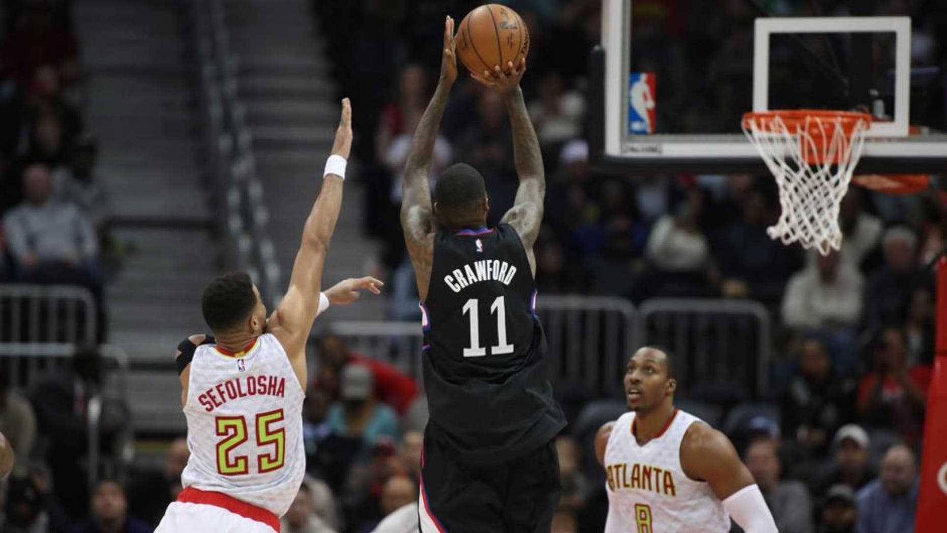 Jan 23, 2017; Atlanta, GA, USA; LA Clippers guard Jamal Crawford (11) shoots against Atlanta Hawks forward Thabo Sefolosha (25) in the fourth quarter of their game at Philips Arena. The Clippers won 115-105. Mandatory Credit: Jason Getz-USA TODAY Sports