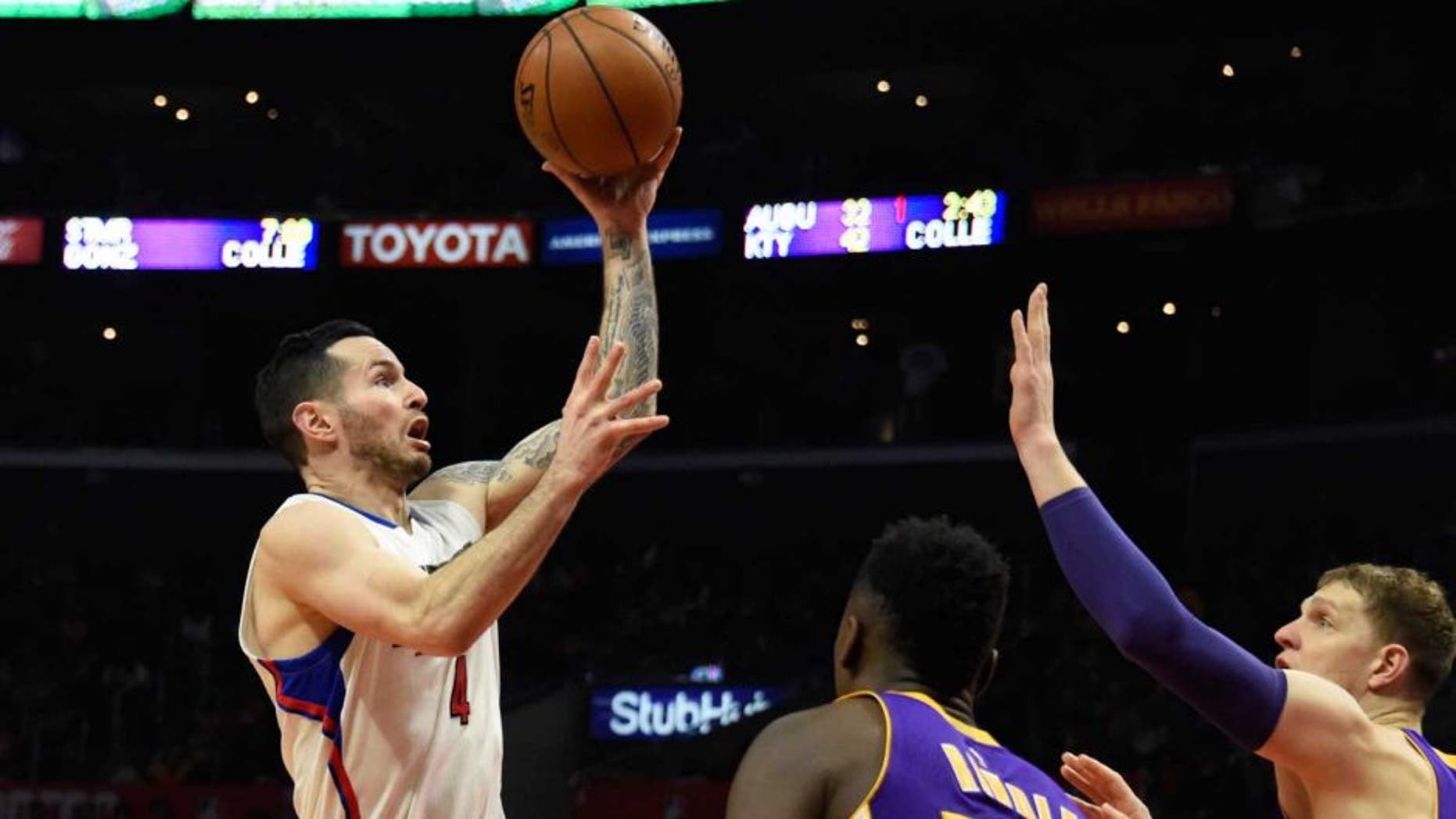 Jan 14, 2017; Los Angeles, CA, USA; LA Clippers guard J.J. Redick (4) shoots against Los Angeles Lakers forward Julius Randle (30) during the NBA game at the Staples Center. Mandatory Credit: Richard Mackson-USA TODAY Sports