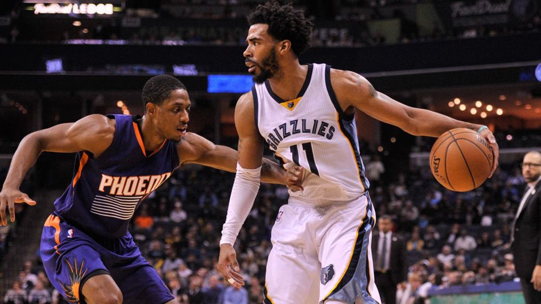 Feb 8, 2017; Memphis, TN, USA; Phoenix Suns guard Brandon Knight (11) guards Memphis Grizzlies guard Mike Conley (11) during the game at FedExForum. Memphis Grizzlies defeated the Phoenix Suns 110-91. Mandatory Credit: Justin Ford-USA TODAY Sports
