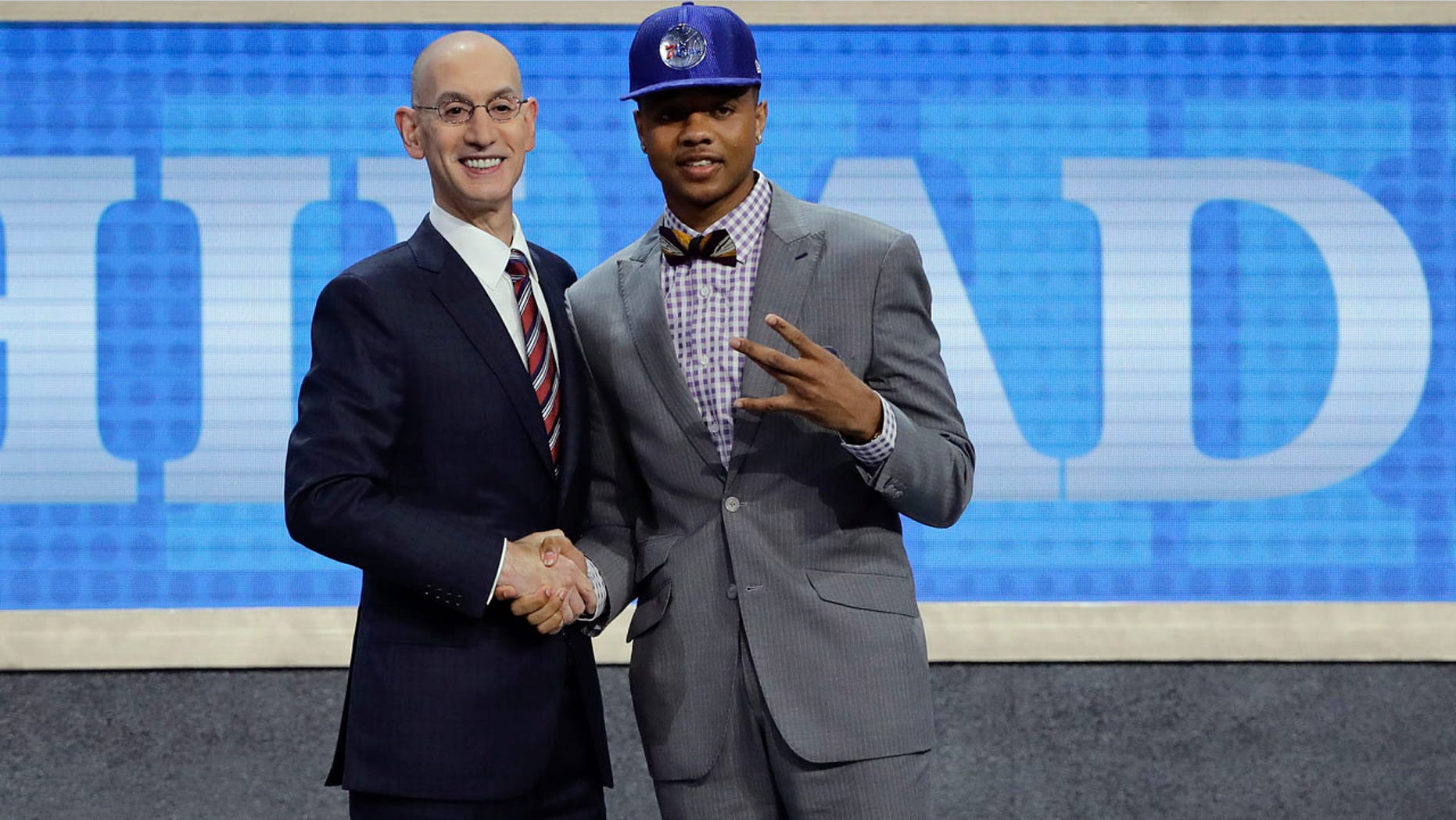 Washington's Markelle Fultz, right, poses for a photo with NBA Commissioner Adam Silver after being selected by the Philadelphia 76ers as the No. 1 pick overall during the NBA basketball draft, Thursday, June 22, 2017, in New York. (AP Photo/Frank Franklin II)