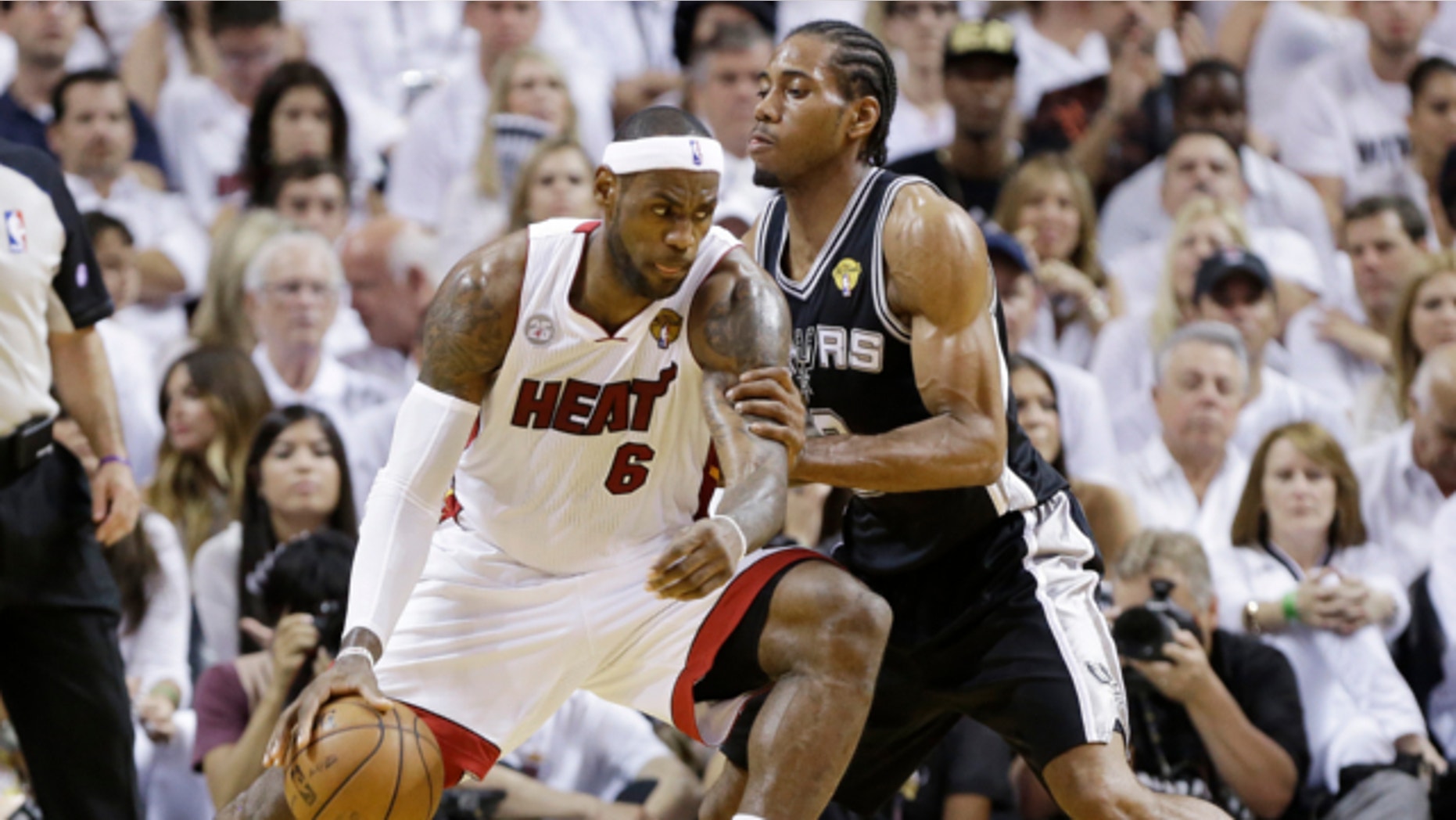 June 20, 2013: San Antonio Spurs' Kawhi Leonard (2) defends against Miami Heat's LeBron James (6) during the first half in Game 7 of the NBA basketball championships in Miami.