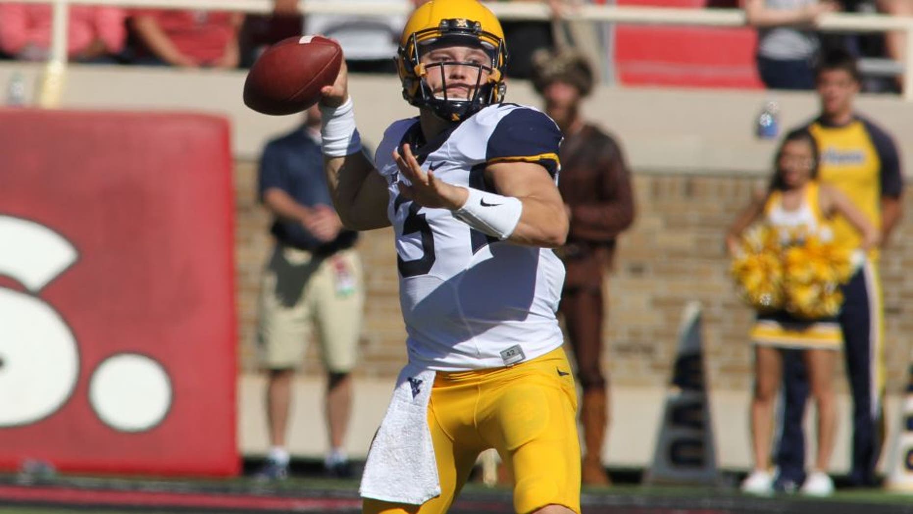 Oct 15, 2016; Lubbock, TX, USA; West Virginia Mountaineers quarterback Skyler Howard (3) prepares to make a throw against the Texas Tech Red Raiders in the first half at Jones AT&T Stadium. Mandatory Credit: Michael C. Johnson-USA TODAY Sports