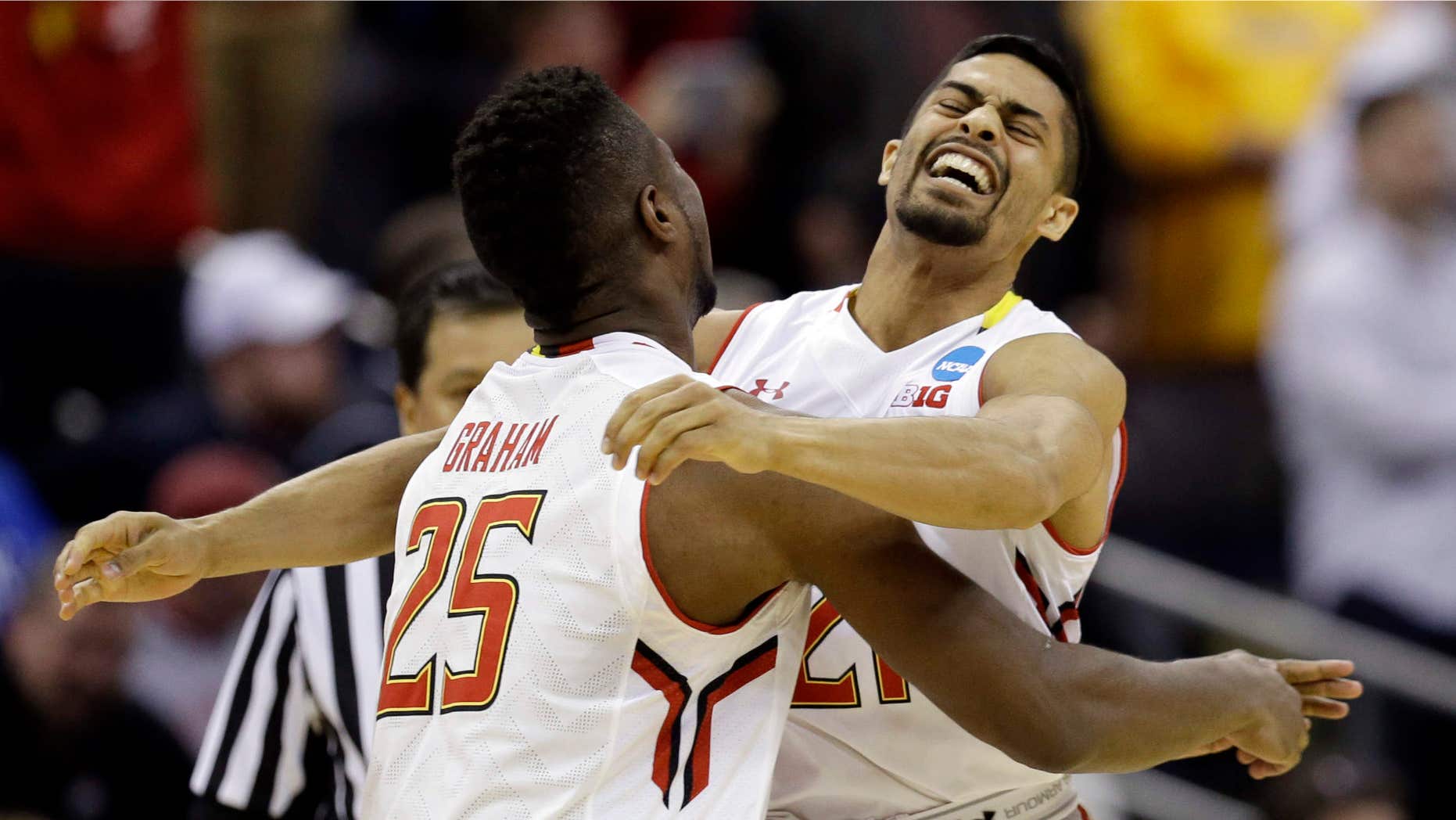 March 20, 2015: Maryland's Jonathan Graham (25) and Varun Ram celebrate after a 65-62 win over Valparaiso in an NCAA tournament college basketball game in the Round of 64 in Columbus, Ohio.