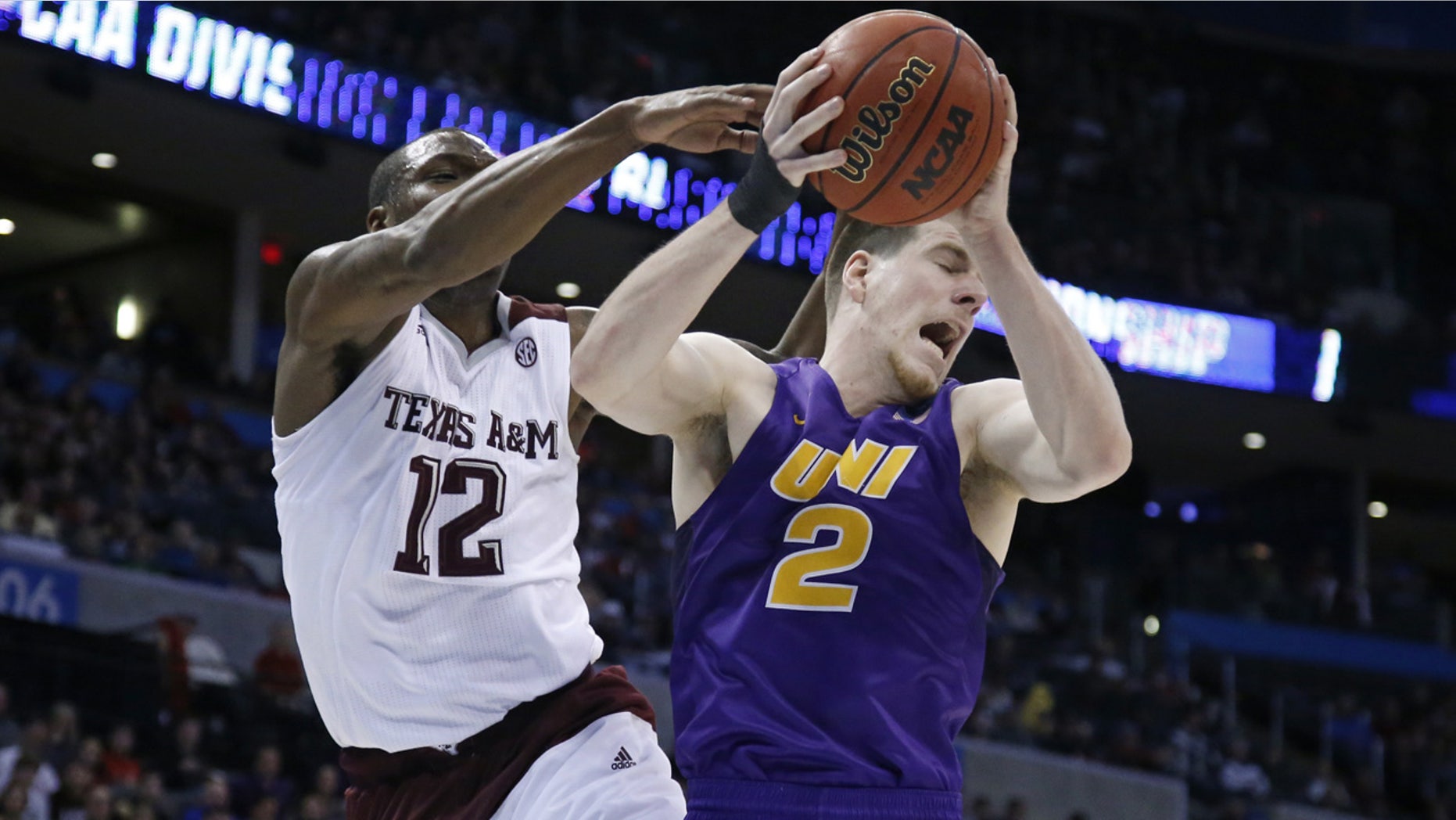 March 20, 2016: Northern Iowa forward Klint Carlson (2) grabs a rebound in front of Texas A&M guard Jalen Jones (12) in the first half of a second-round men's college basketball game in the NCAA Tournament in Oklahoma City (AP Photo/Sue Ogrocki)
