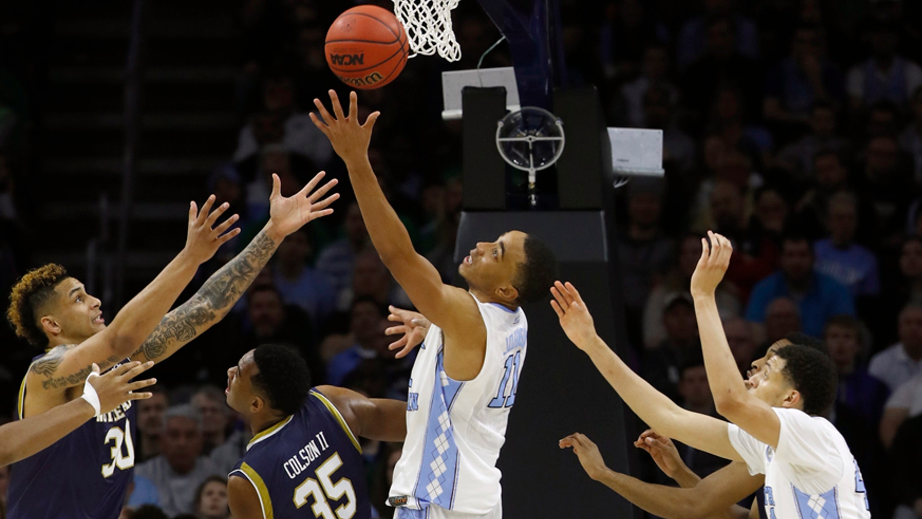 March 27, 2016: Notre Dame's Zach Auguste, far left, Bonzie Colson and North Carolina's Brice Johnson and Justin Jackson chase a rebound during the second half of the East Regional final in the men's NCAA basketball tournament in Philadelphia.