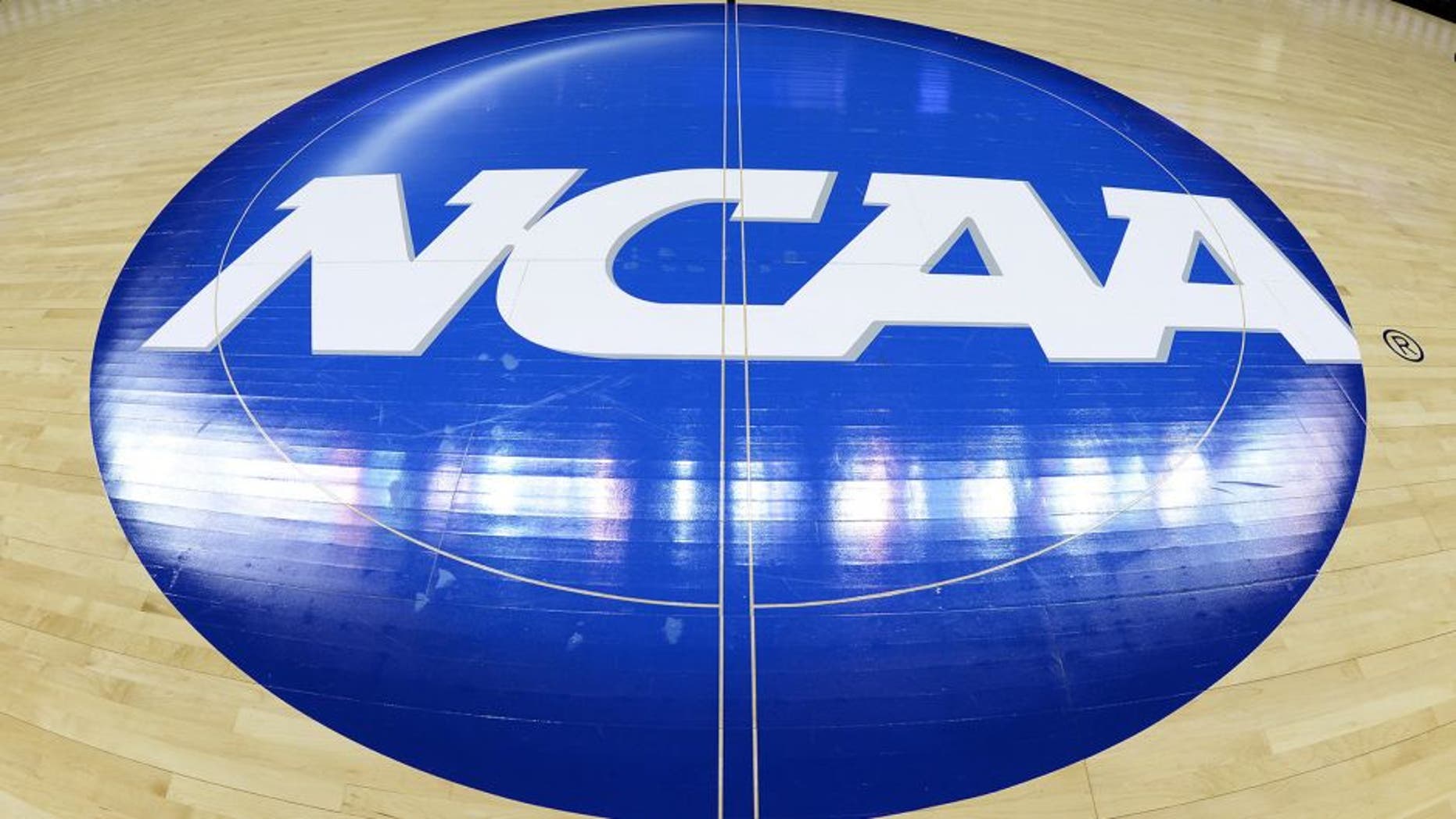 CHARLOTTE, NC - MARCH 22: A view of the NCAA logo at mid-court prior to a game between the Michigan State Spartans and the Virginia Cavaliers during the third round of the 2015 NCAA Men's Basketball Tournament at Time Warner Cable Arena on March 22, 2015 in Charlotte, North Carolina. Michigan State won 60-54. (Photo by Lance King/Getty Images)