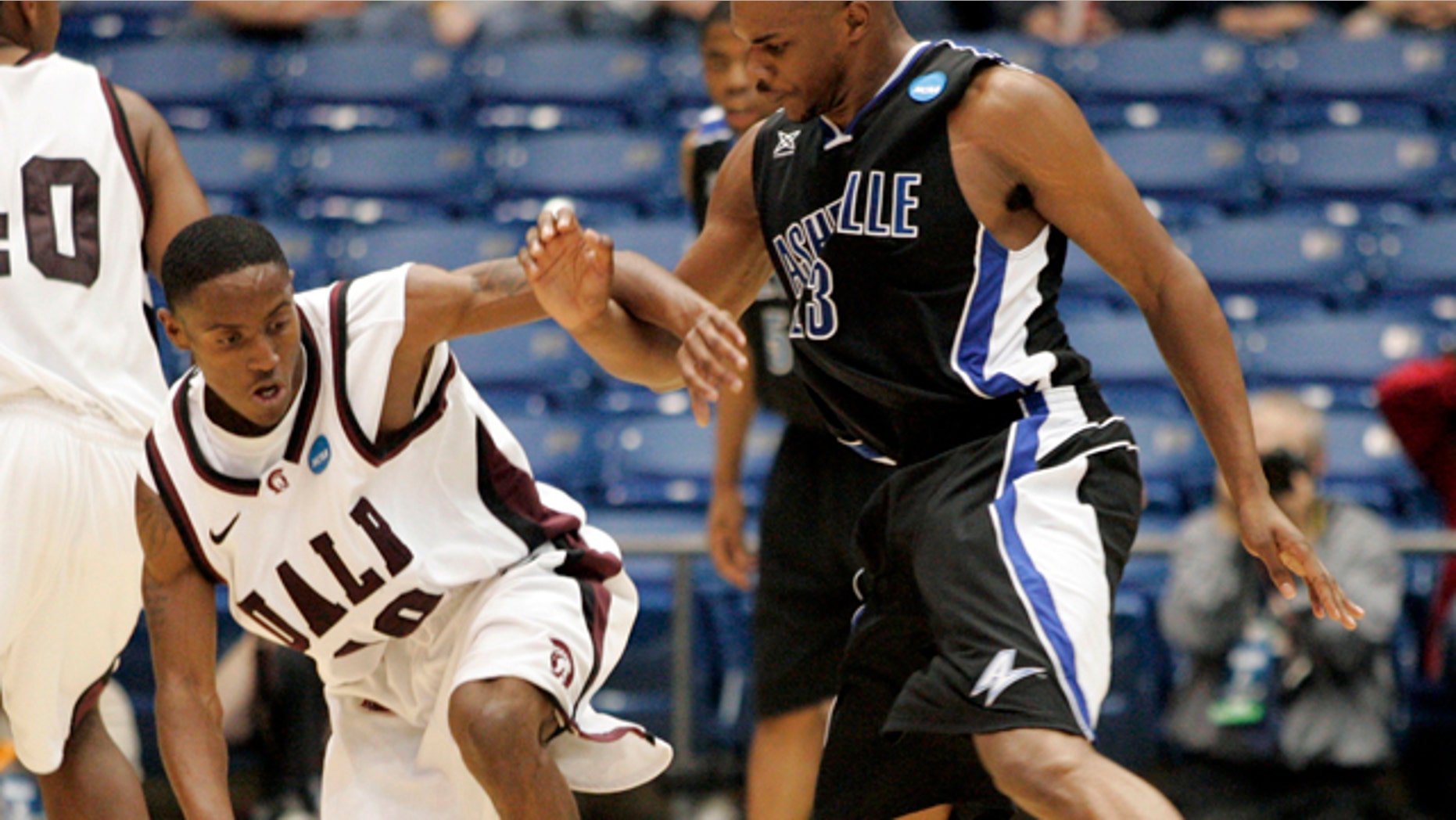 March 15, 2011: Arkansas-Little Rock guard D'Andre Williams (10) is guarded by North Carolina-Asheville forward John Williams (23) in the first half of a first round NCAA college basketball game.