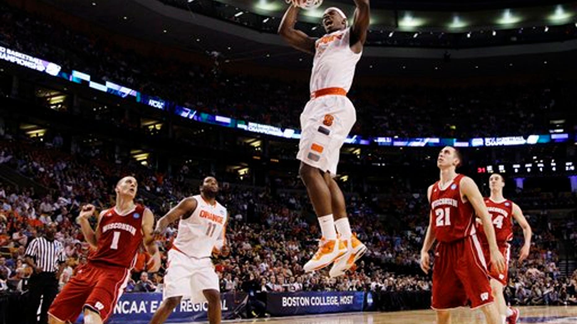 March 22, 2012: Syracuse forward C.J. Fair (5) dunks in front of Wisconsin guards Ben Brust (1) and Josh Gasser (21) in the first half of an East Regional semifinal game in the NCAA men's college basketball tournament, Thursday in Boston.