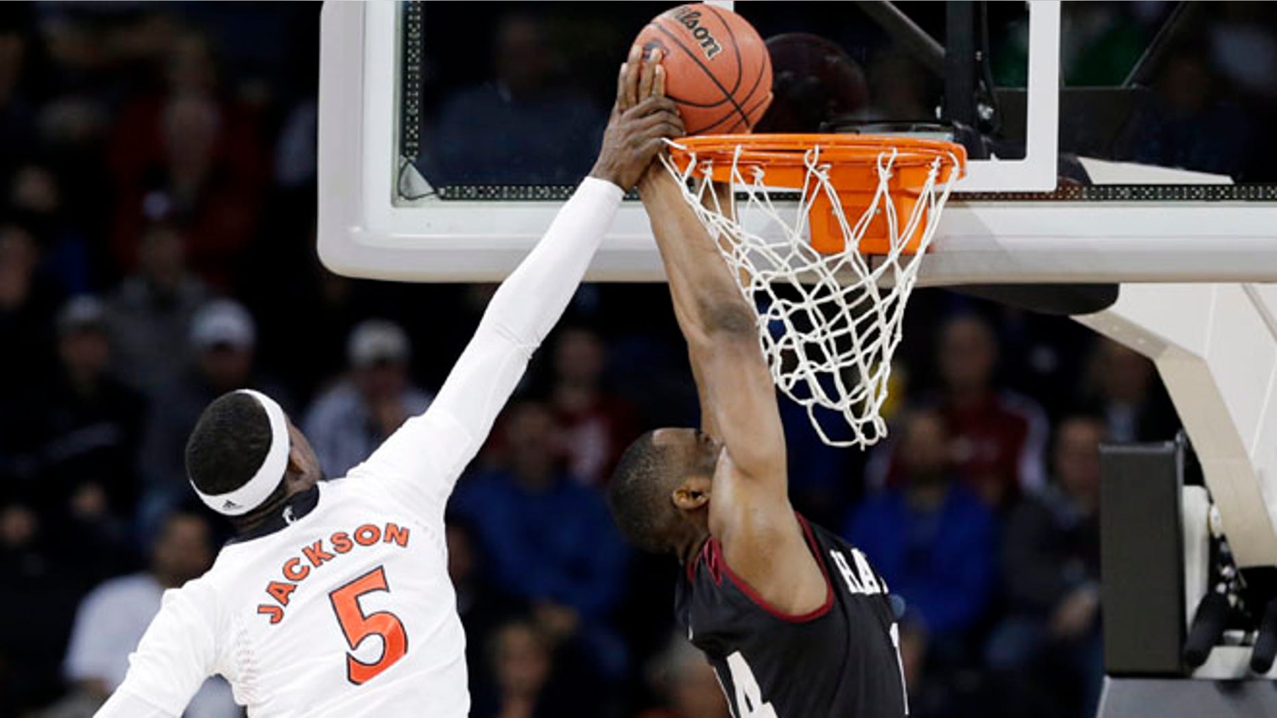Mar. 20, 2014: Cincinnati's Justin Jackson (5) tries to stop a shot by Harvard's Steve Moundou-Missi in the first half during a second-round game of the NCAA college basketball tournament in Spokane, Wash.