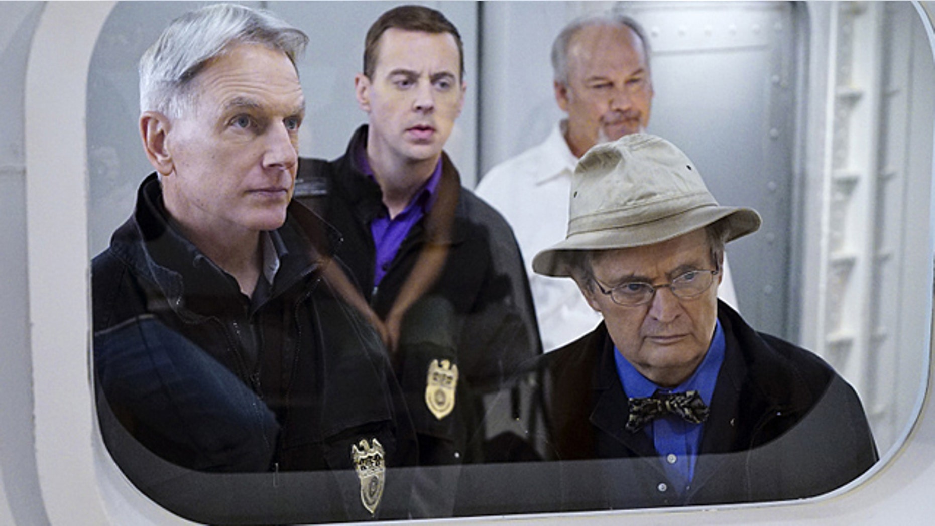 'Decompressed' -- When a deep sea diver is murdered on the job, his body and suspected co-workers must remain in a high-tech decompression chamber for four days, leaving the NCIS team to complete an unorthodox investigation from outside the tank. Pictured left to right: Mark Harmon, Sean Murray, Brett Rice and David McCallum (Sonja Flemming/CBS)