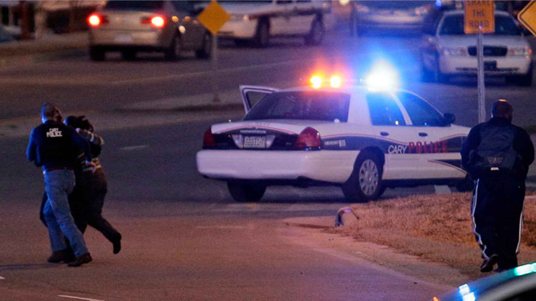 Feb. 10, 2011: Police run with a hostage at a Wachovia Bank in Cary, N.C., where an armed man took four people hostage.