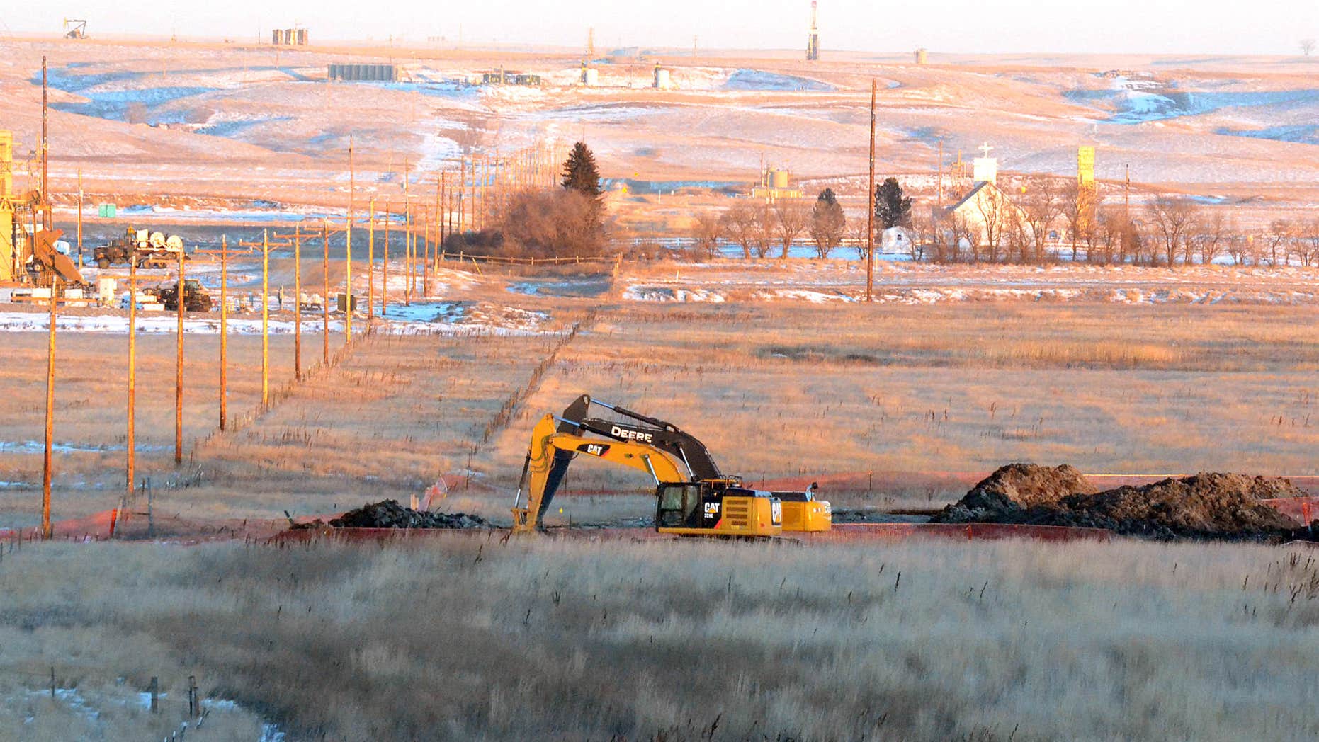 Jan. 12, 2015: Crews dig up land at a saltwater spill site near Blacktail Creek outside Williston, N.D.