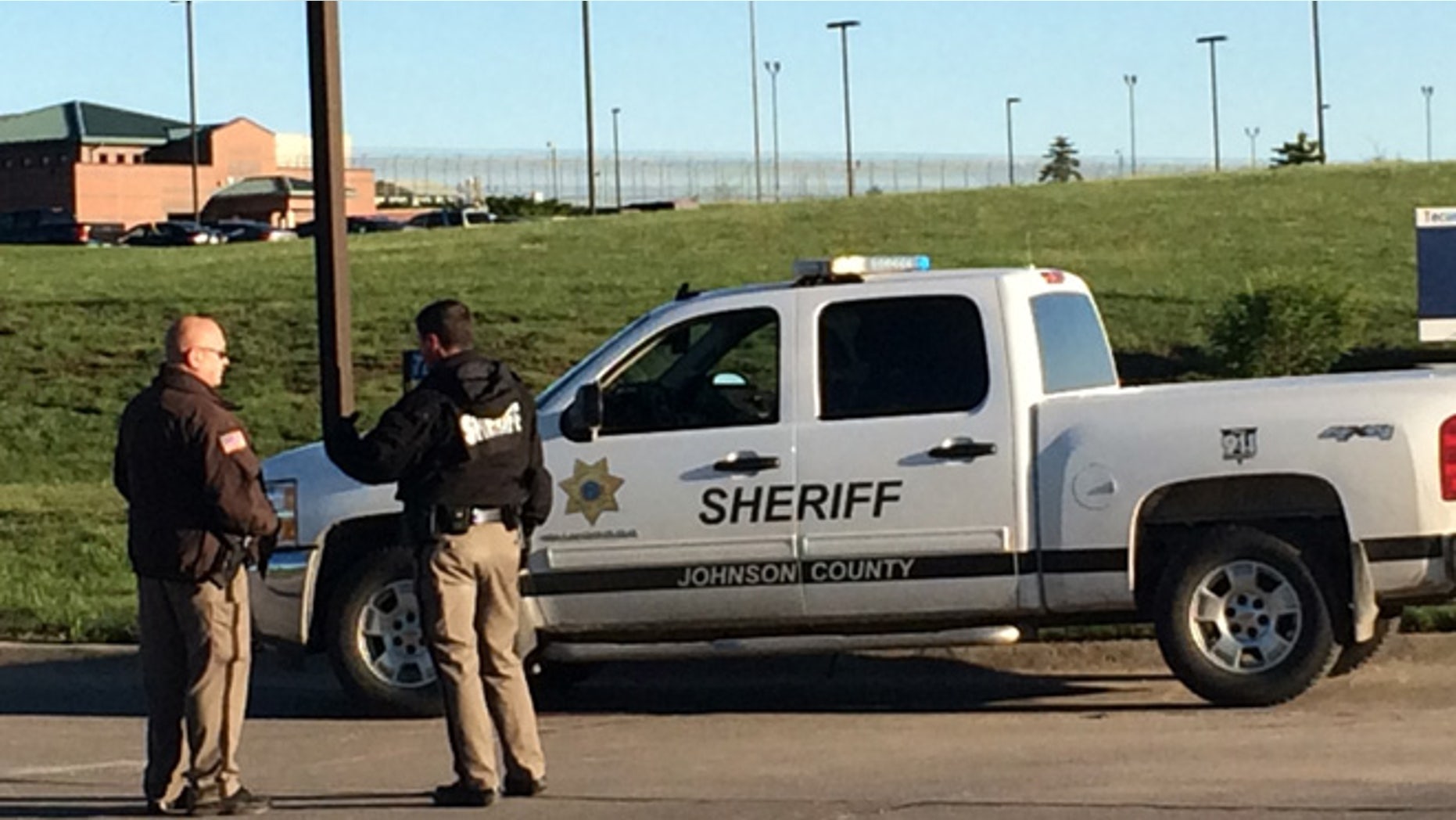 May 11, 2015: Members of the Johnson County Sheriff's Department stand outside the the Tecumseh State Correctional Institution in Tecomseh, Neb.