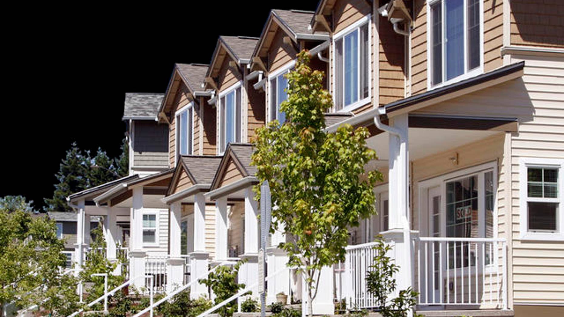 New townhouses for sale are shown in Beaverton, Ore., Monday, July 26, 2010. Home prices rose in May for the second straight month as federal tax incentives pulled more buyers into the market. .(AP Photo/Don Ryan)
