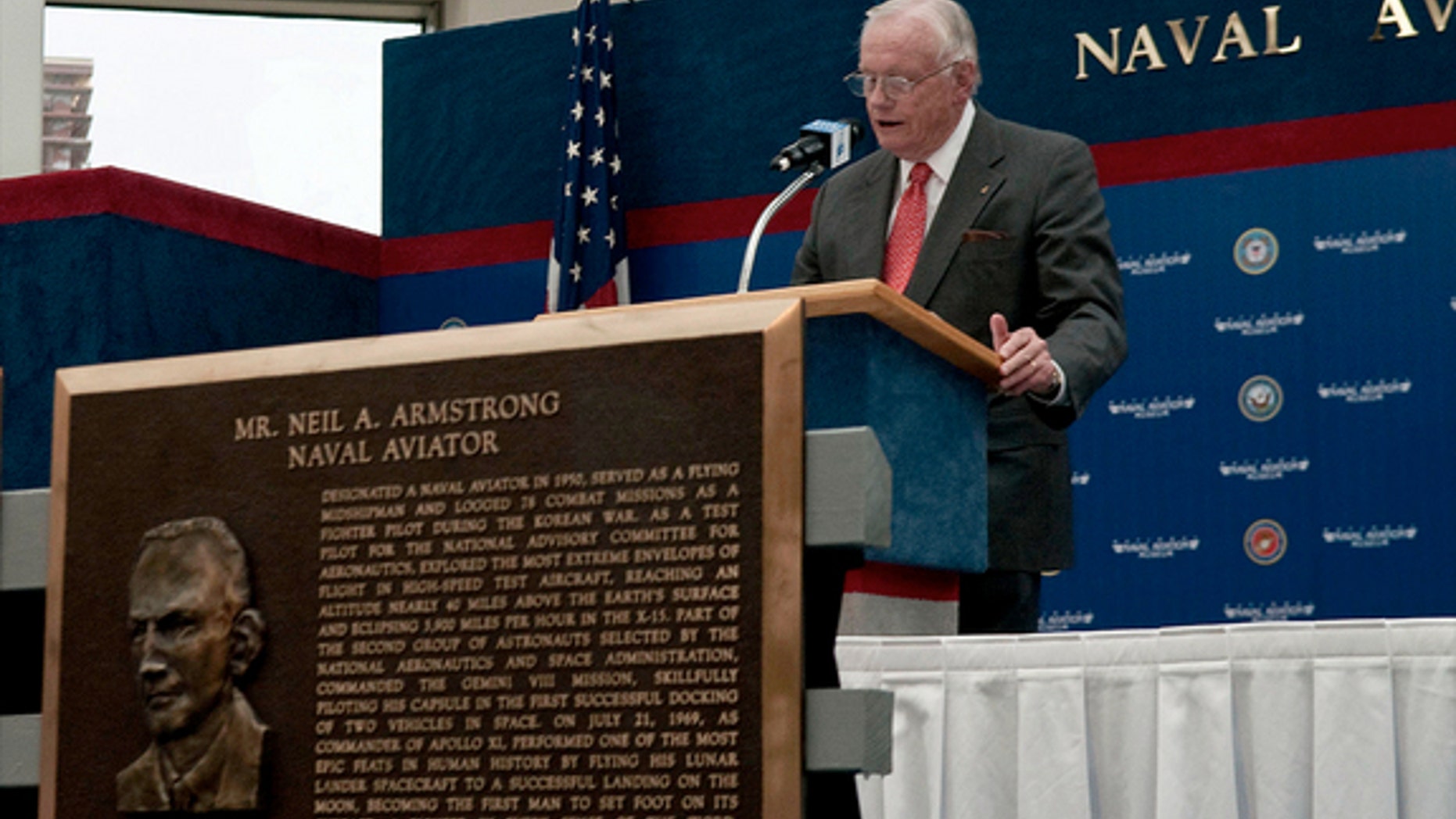 Neil Armstrong gives an acceptance speech after being inducted in 2010 into the Naval Aviation Hall of Honor at the National Naval Aviation Museum in Pensacola, Fla. The Navy will honor him with a burial sea.
