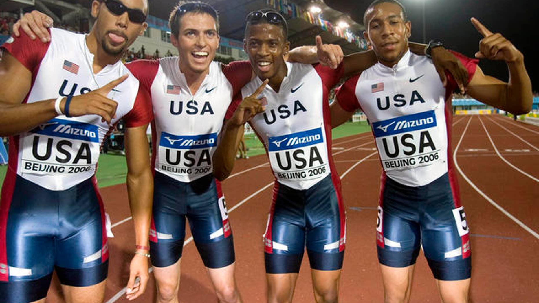 From left United State's Quentin Summers, Chris Carter, Justin Oliver and Bryshon Nellum pose for photographs after winning the final of the Men's 4x400 Meters Relay event of the IAAF Track and Field World Junior Championships held in Beijing, China, Sunday, Aug 20, 2006. The United States team clinch the gold medal with a time of 3:03.76 minutes. (AP Photo/Ng Han Guan)