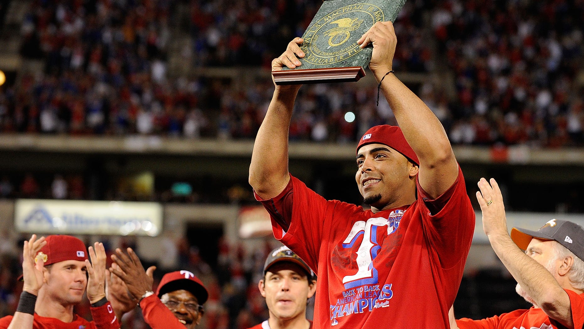 ARLINGTON, TX - OCTOBER 15: Nelson Cruz #17 of the Texas Rangers holds the AL championship series Most Valuable Player Award after defeating the Detroit Tigers in Game Six of the American League Championship Series 15-5 to advance to the World Series at Rangers Ballpark in Arlington on October 15, 2011 in Arlington, Texas. (Photo by Kevork Djansezian/Getty Images)