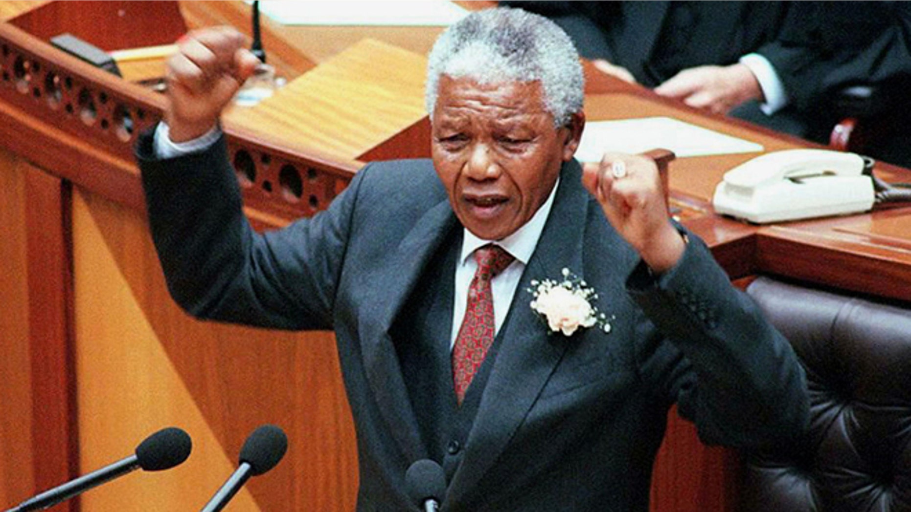 Feb. 7, 1977: South African President Nelson Mandela gestures during his state of the nation address at the opening of Parliament in Cape Town. Mandela concentrated on crime and the economy, the country's two major problems at the time after nearly three years of democracy.