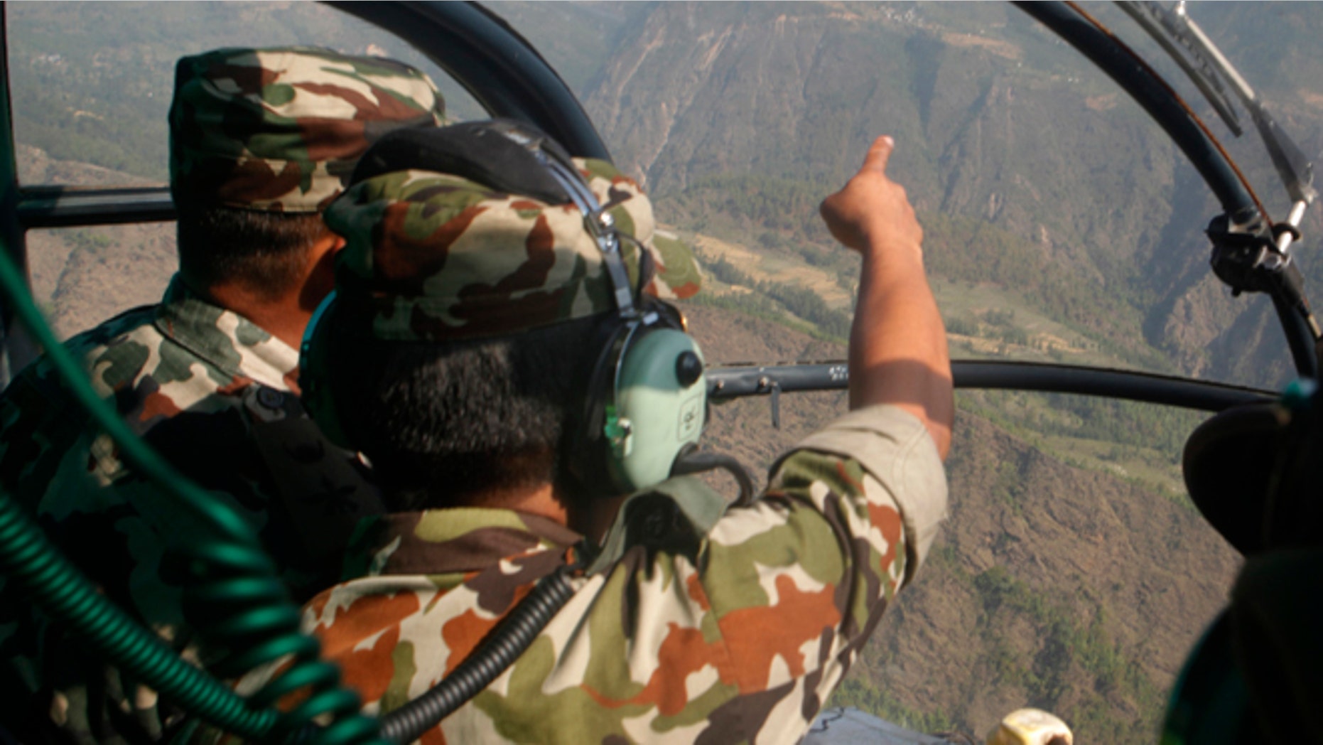 May 14, 2015: Nepalese army men search for the missing U.S. Marine helicopter in the earthquake affected Dolakha District, Nepal.
