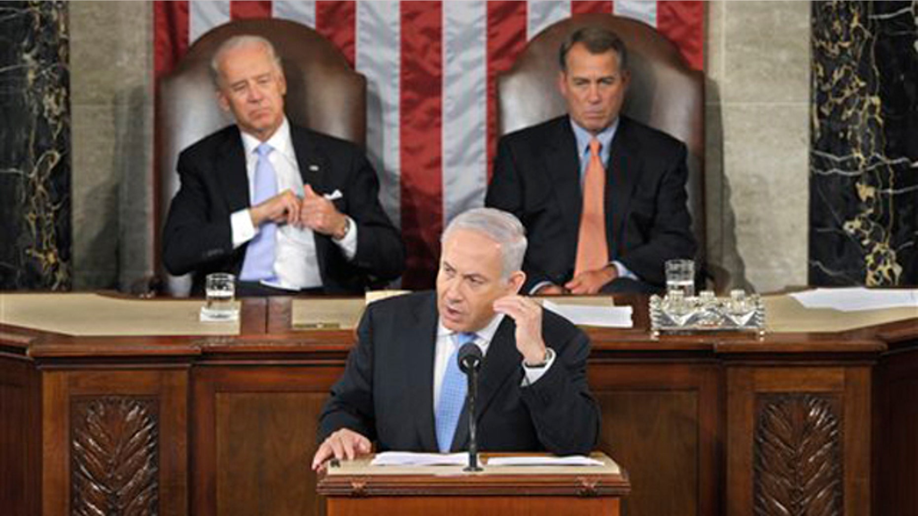Israel's Prime Minister Benjamin Netanyahu gestures while addressing a joint meeting of Congress in Washington May 24. House Speaker John Boehner, right, and Vice President Joe Biden listen.
