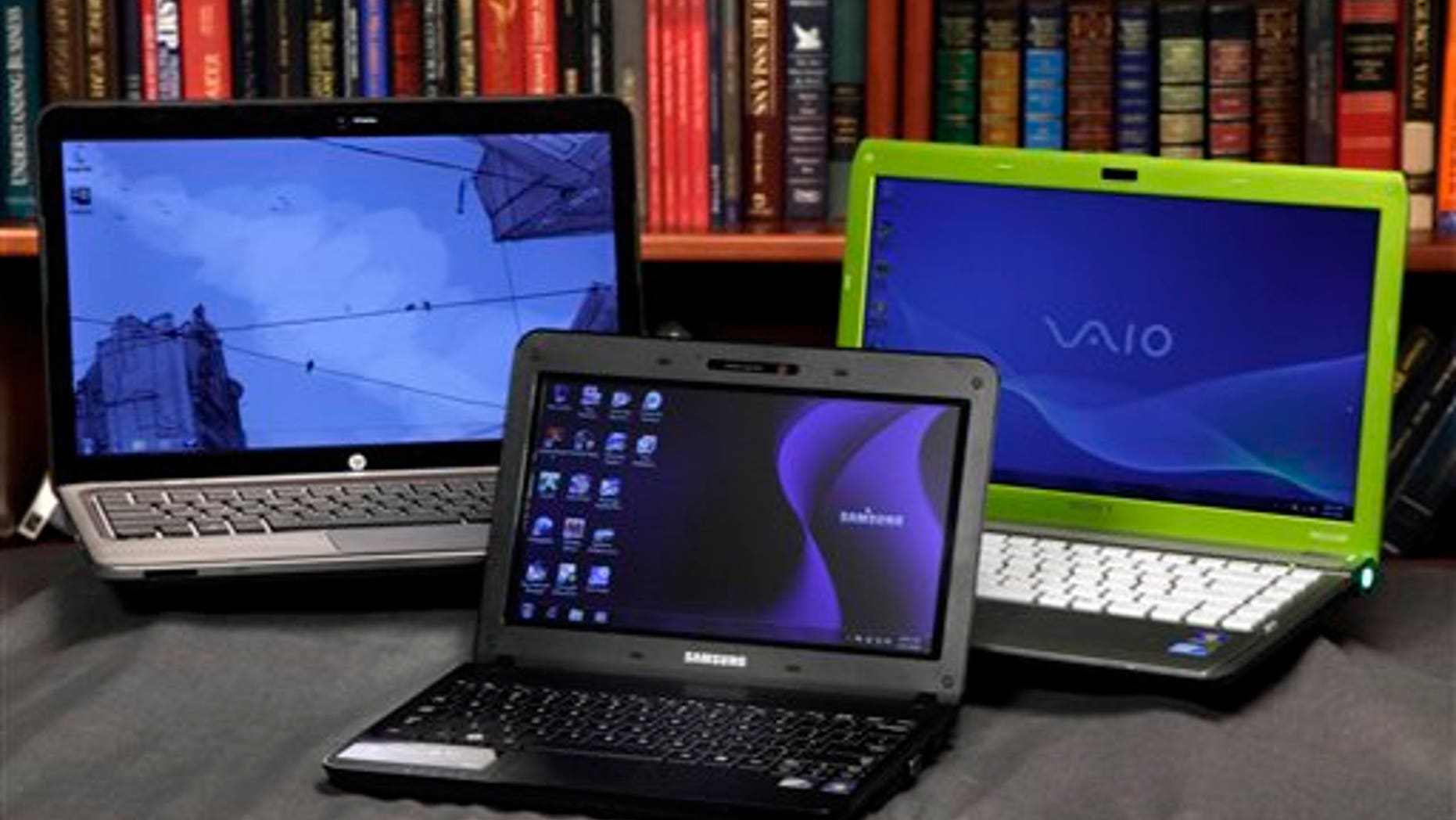 The HP Pavilion dm4, left, the Sony Vaio, right, laptops and the Samsung NB30 netbook are shown in this photo, in New York, Wednesday, Aug. 11, 2010.