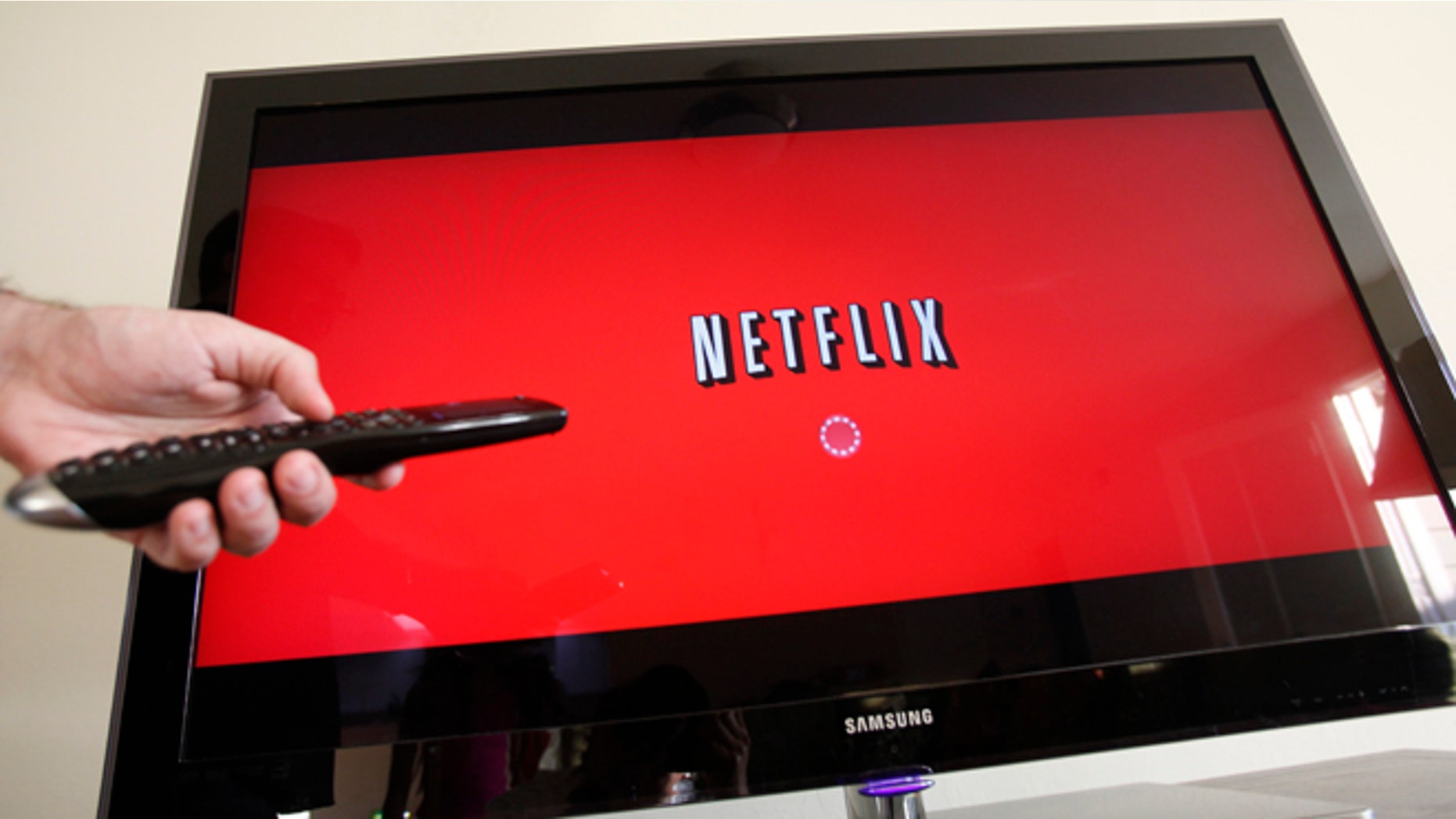 In this July 20, 2010 file photo, a person uses Netflix in Palo Alto, Calif.