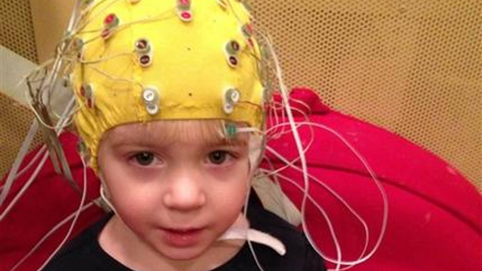 This undated handout photo provided by the Auditory Neuroscience Lab, Northwestern University, shows scalp electrodes to pick up how children's brains react to sounds such as speech in a noisy background.
