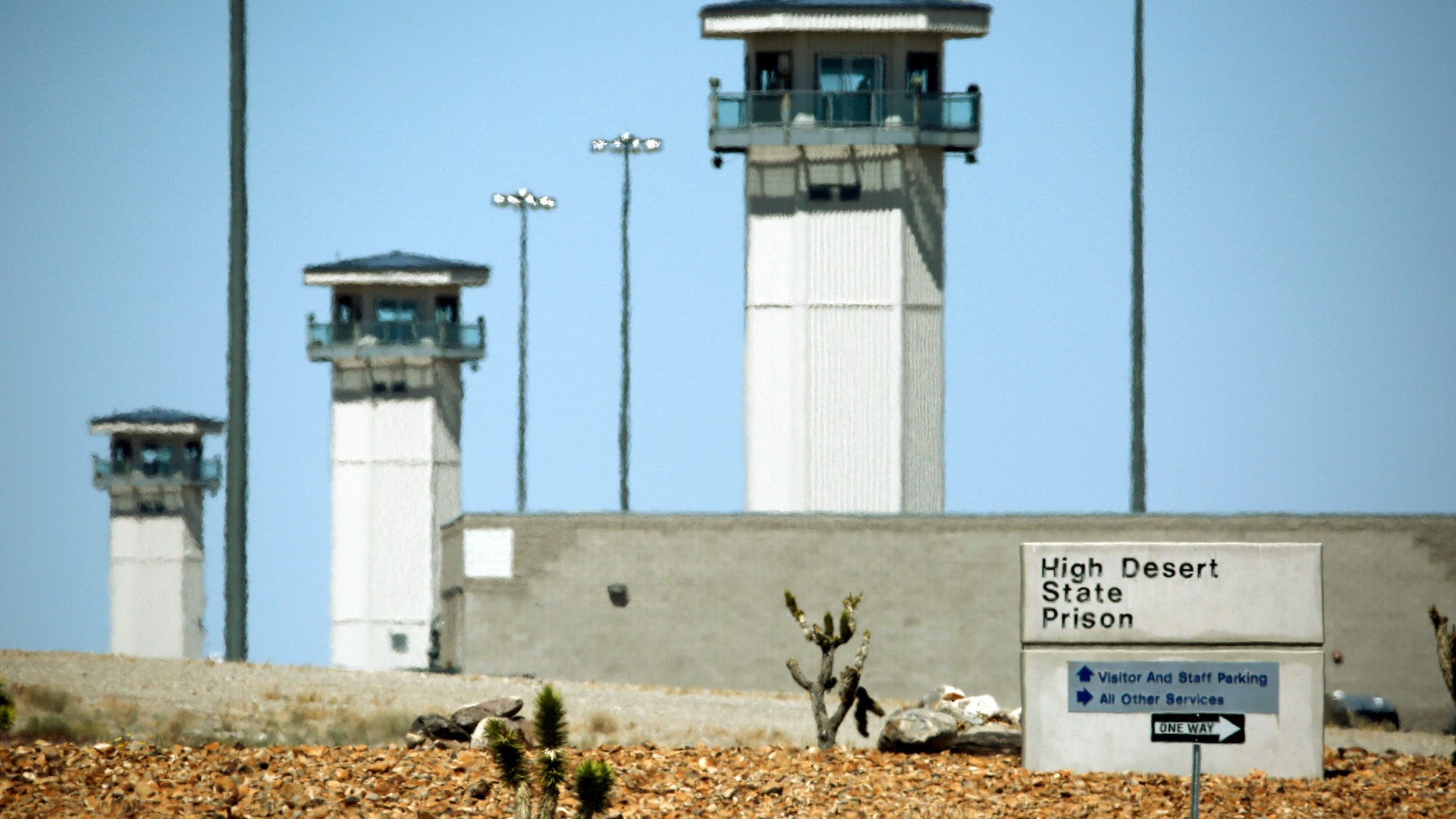 FILE - April 15, 2016: Guard towers are seen at High Desert State Prison in Indian Springs, Nev.