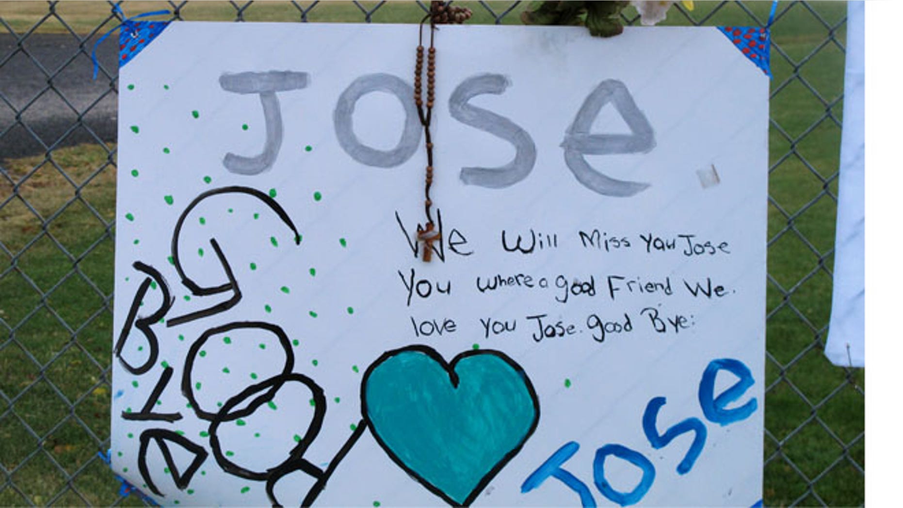 Oct. 28, 2013: A remembrance of the shooter, Jose Reyes, 12, hangs on a fence as students return to Sparks Middle School in Sparks, Nev.