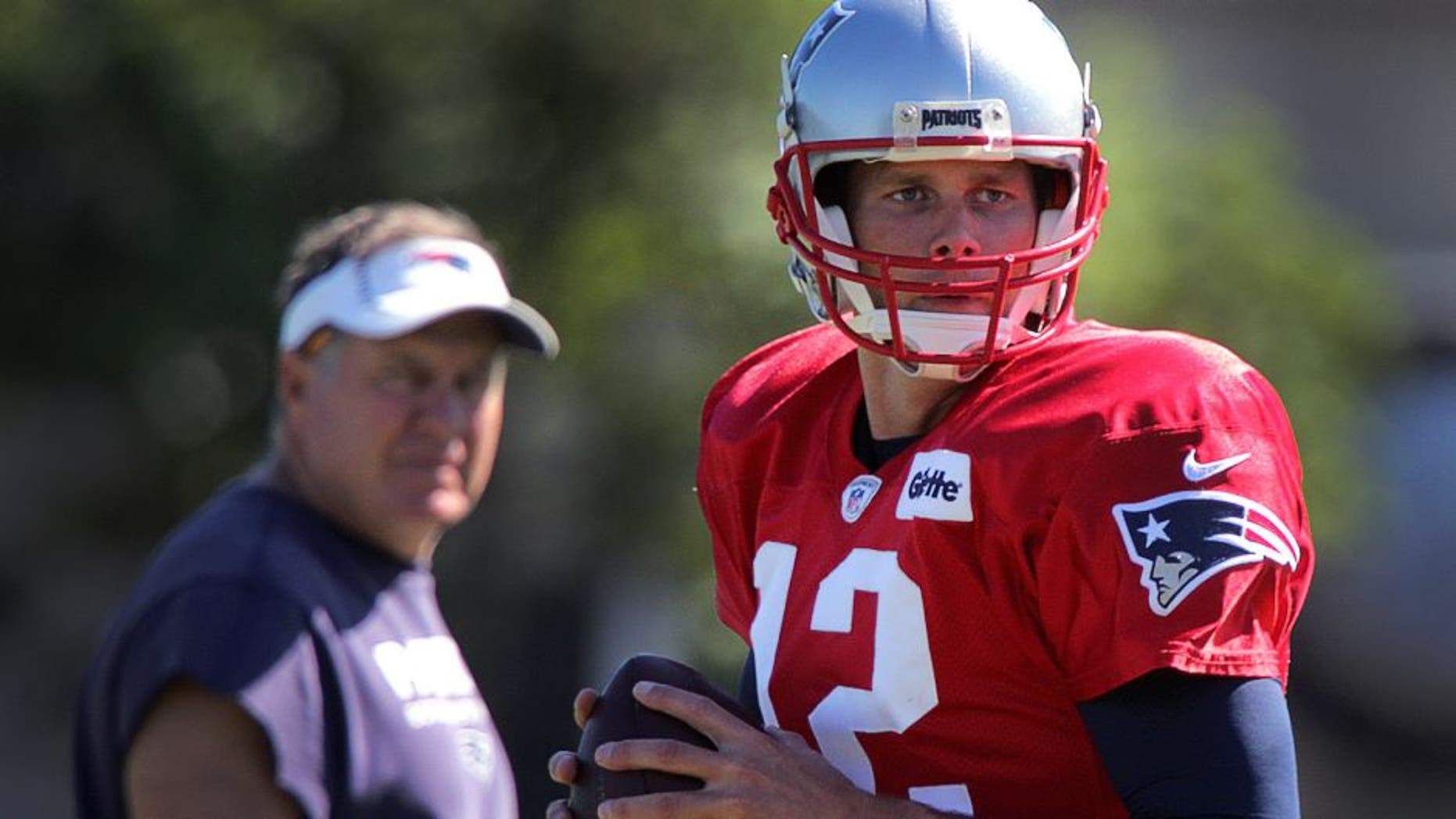 FOXBOROUGH, MA - AUGUST 23: New England Patriots quarterback Tom Brady (12) is back on the field at Gillette Stadium in Foxborough, Mass., on Aug. 23, 2016, under the watchful eye of New England Patriots head coach Bill Belichick after a two day excused absence. (Photo by Barry Chin/The Boston Globe via Getty Images)