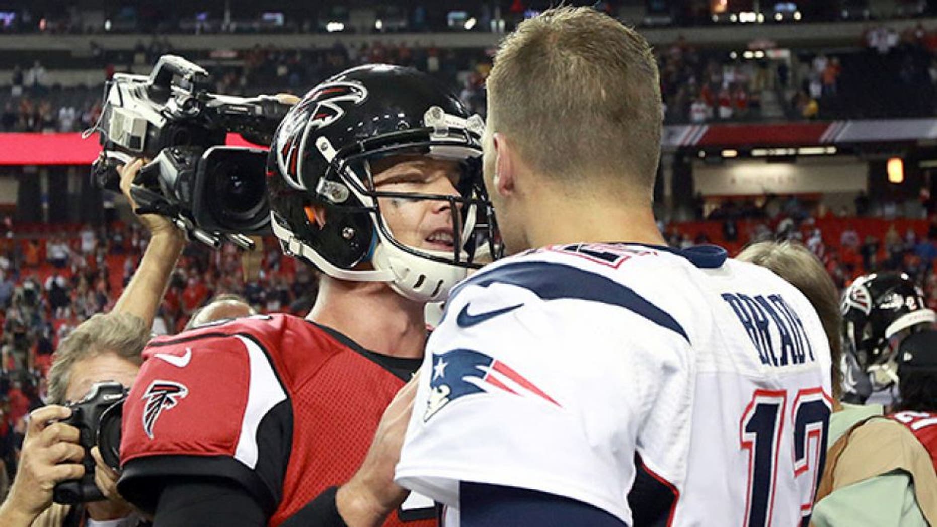 ATLANTA - SEPTEMBER 29: New England Patriots quarterback Tom Brady (#12) and Atlanta Falcons quarterback Matt Ryan (#2) shake hands at the end of the game. The New England Patriots play the Atlanta Falcons at the Georgia Dome in Atlanta, Sept. 29, 2013. (Photo by Barry Chin/The Boston Globe via Getty Images)