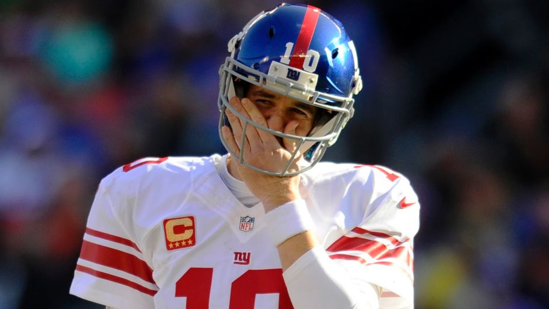 CLEVELAND, OH - NOVEMBER 27, 2016: Quarterback Eli Manning #10 of the New York Giants wipes his face as he walks onto the field during a game against the Cleveland Browns on November 27, 2016 at FirstEnergy Stadium in Cleveland, Ohio. New York won 27-13. (Photo by: Nick Cammett/Diamond Images/Getty Imges)