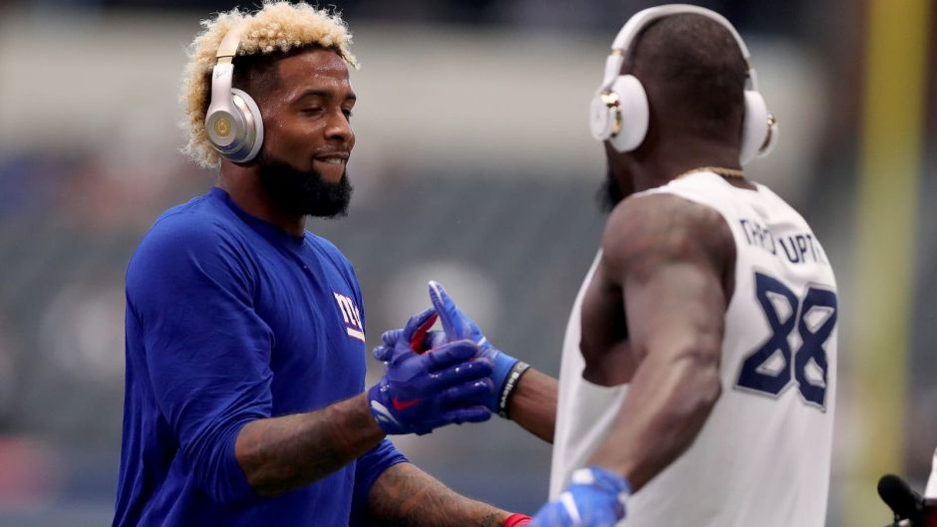ARLINGTON, TX - SEPTEMBER 11: Odell Beckham #13 of the New York Giants greets Dez Bryant #88 of the Dallas Cowboys during pregame warm up at AT&T Stadium on September 11, 2016 in Arlington, Texas. (Photo by Tom Pennington/Getty Images)