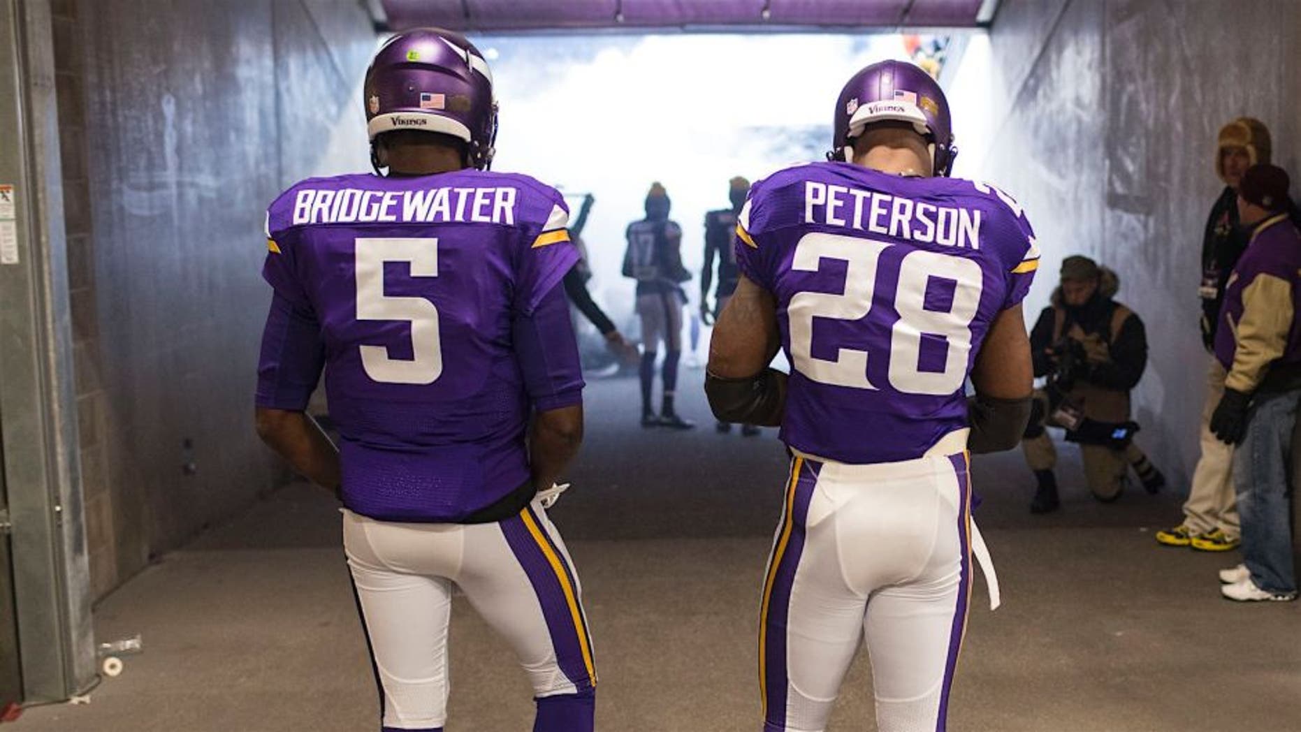 MINNEAPOLIS, MN - DECEMBER 27: Teddy Bridgewater #5 and Adrian Peterson #28 of the Minnesota Vikings prepare to go on field prior to an NFL game against the New York Giants at TCF Bank Stadium December 27, 2015 in Minneapolis, Minnesota. (Photo by Tom Dahlin/Getty Images)
