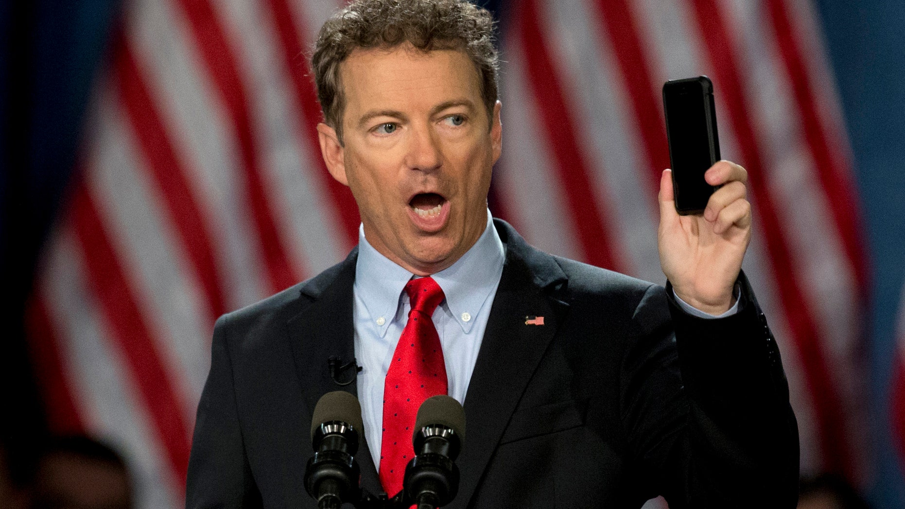 April 7, 2015: Sen. Rand Paul, R-Ky. holds up his cell phone as he speaks before announcing the start of his presidential campaign.