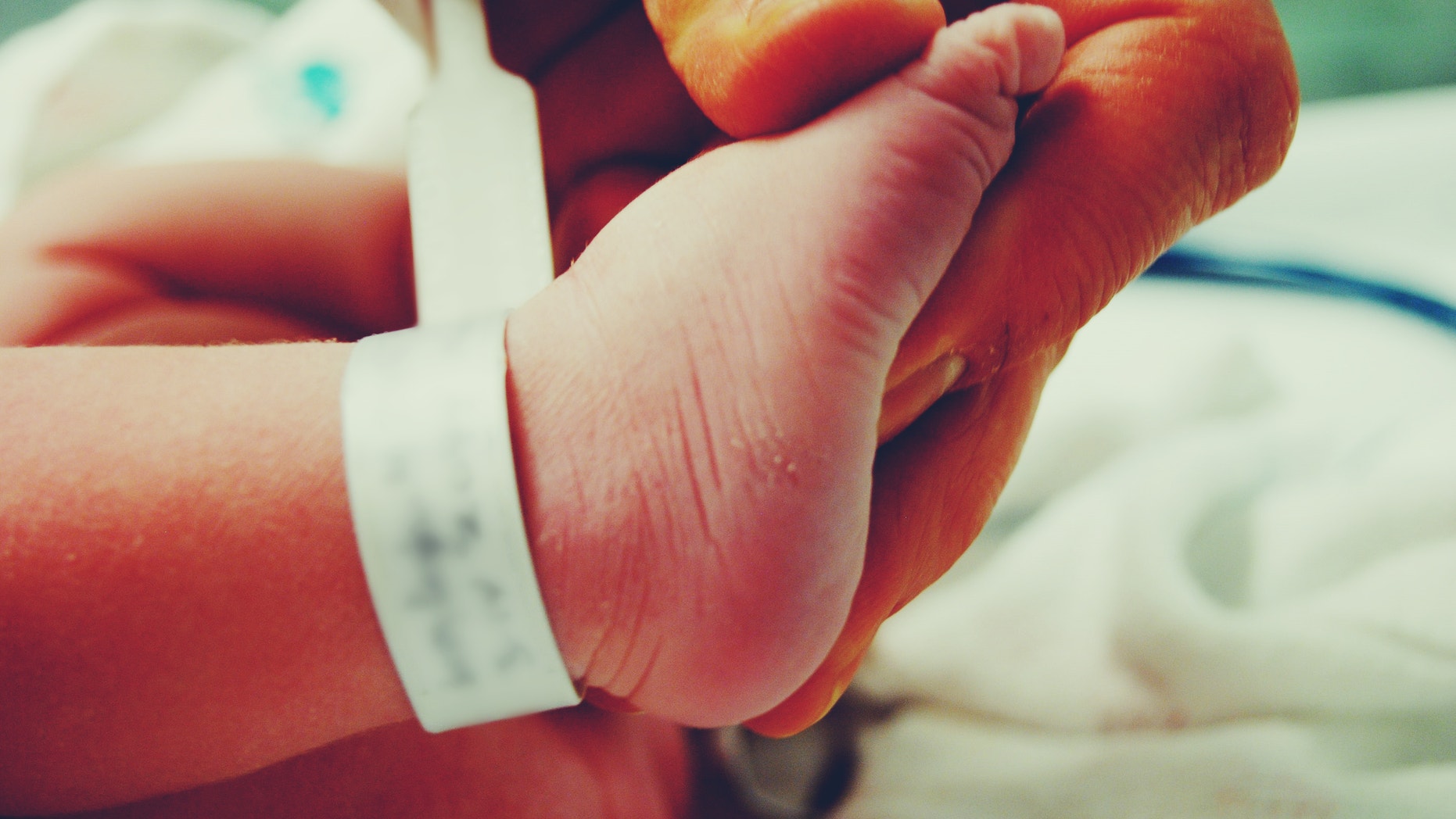Holding My newborn Sons foot
