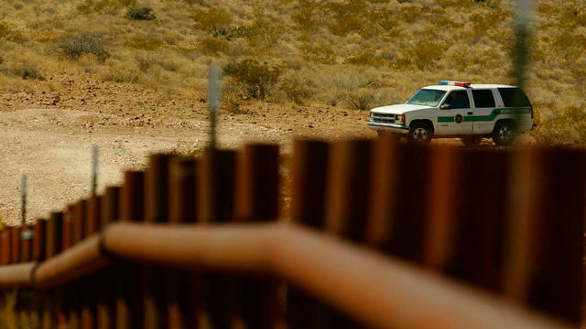 A border patrol car looks over the town of Las Chepas, Mexico near the border with New Mexico.