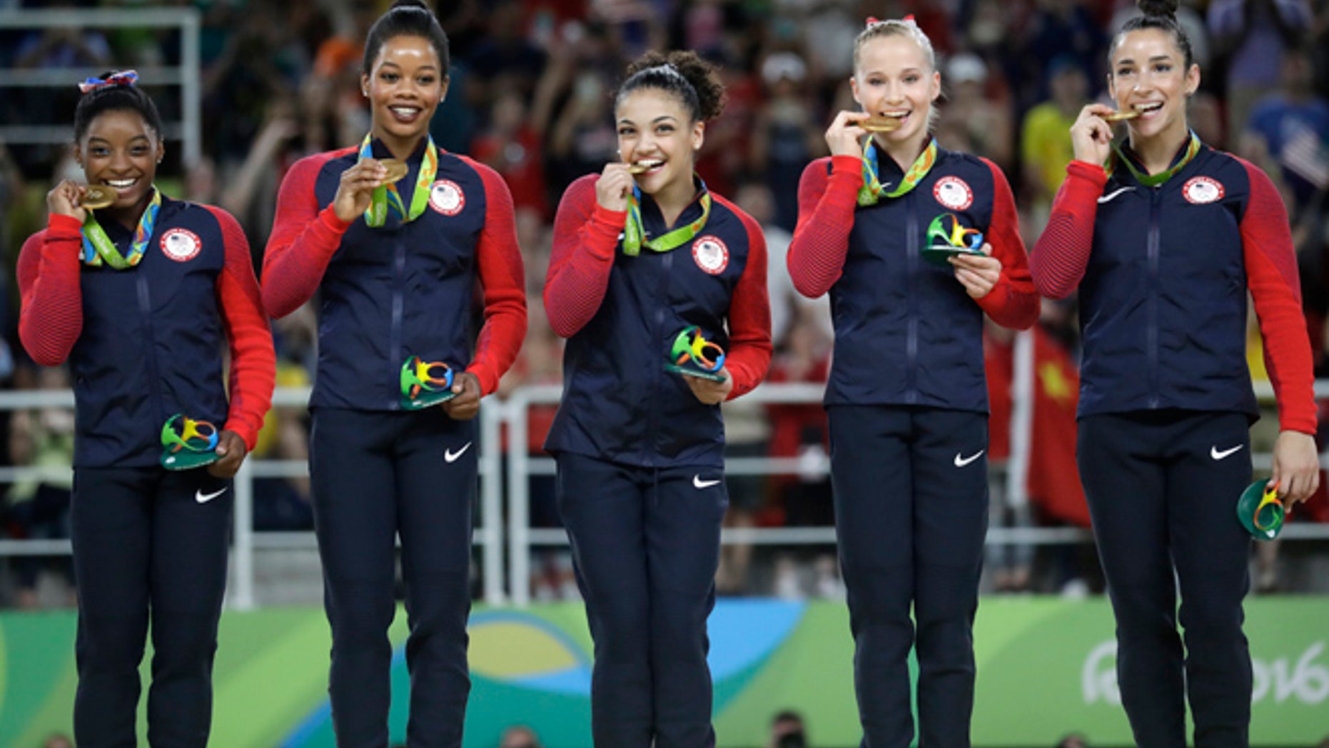U.S. gymnasts, left to right, Simone Biles, Gabrielle Douglas and Madison Kocian wave to the audience at the end of the artistic gymnastics women's team final at the 2016 Summer Olympics in Rio de Janeiro, Brazil, Tuesday, Aug. 9, 2016.