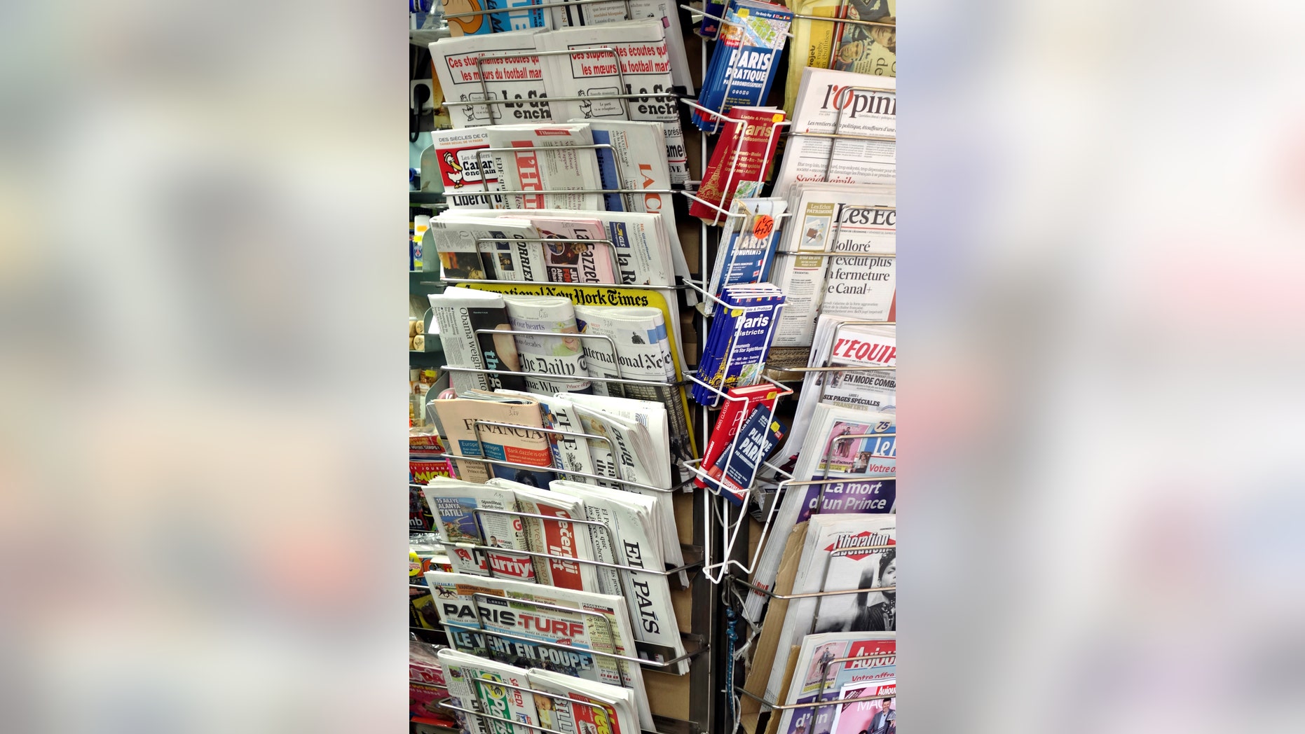 File photo - Newspapers and magazines are seen in a kiosk in Paris, France, April 22, 2016. (REUTERS/Charles Platiau)