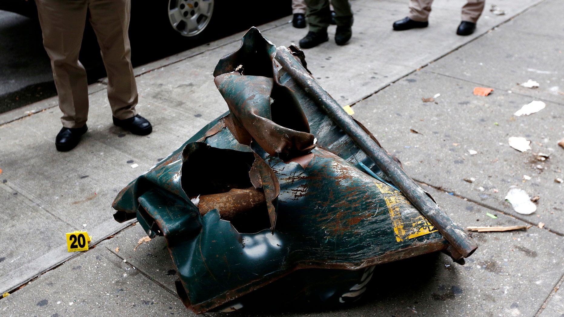 A view of a mangled dumpster at the site of an explosion that occurred on Saturday night in the Chelsea neighborhood of New York, USA, Sept. 18, 2016. (REUTERS/Junstin Lane/Pool)