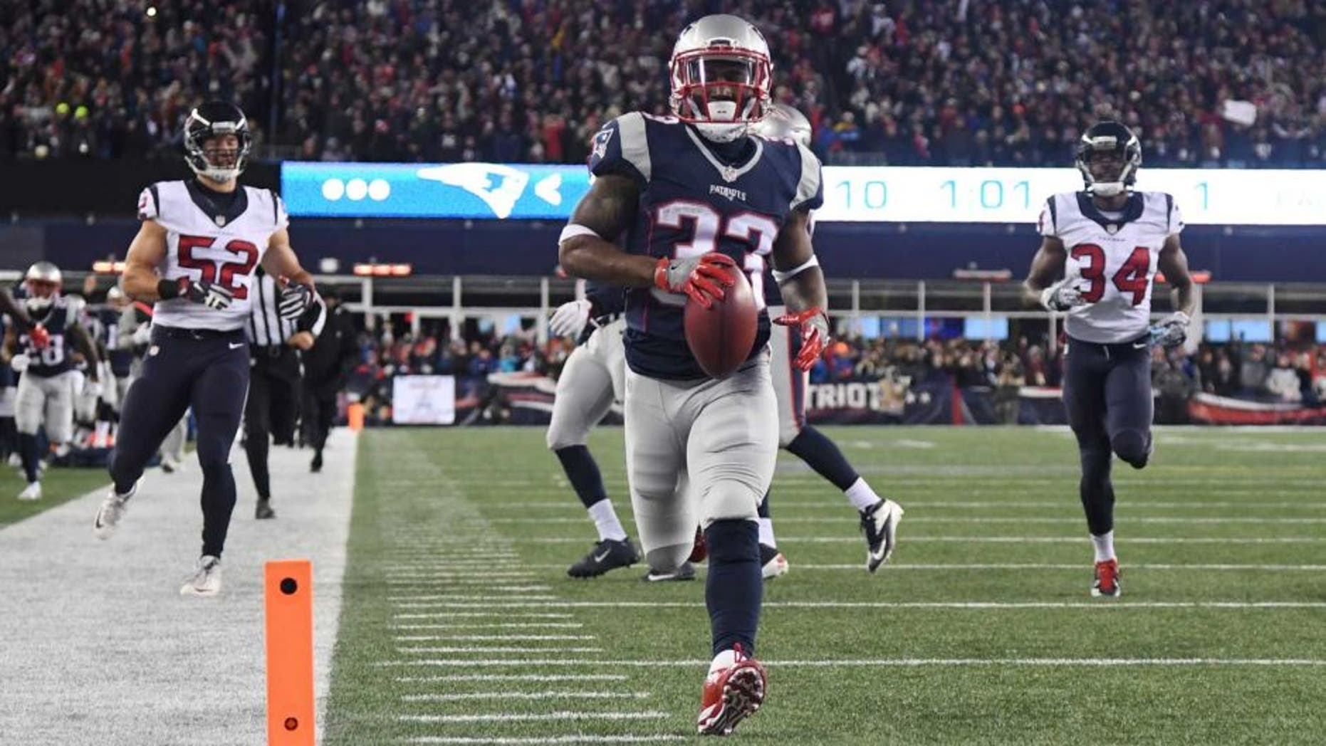 Jan 14, 2017; Foxborough, MA, USA; New England Patriots running back Dion Lewis (33)returns a kick for a touchdown against the Houston Texans during the first quarter in the AFC Divisional playoff game at Gillette Stadium. Mandatory Credit: James Lang-USA TODAY Sports