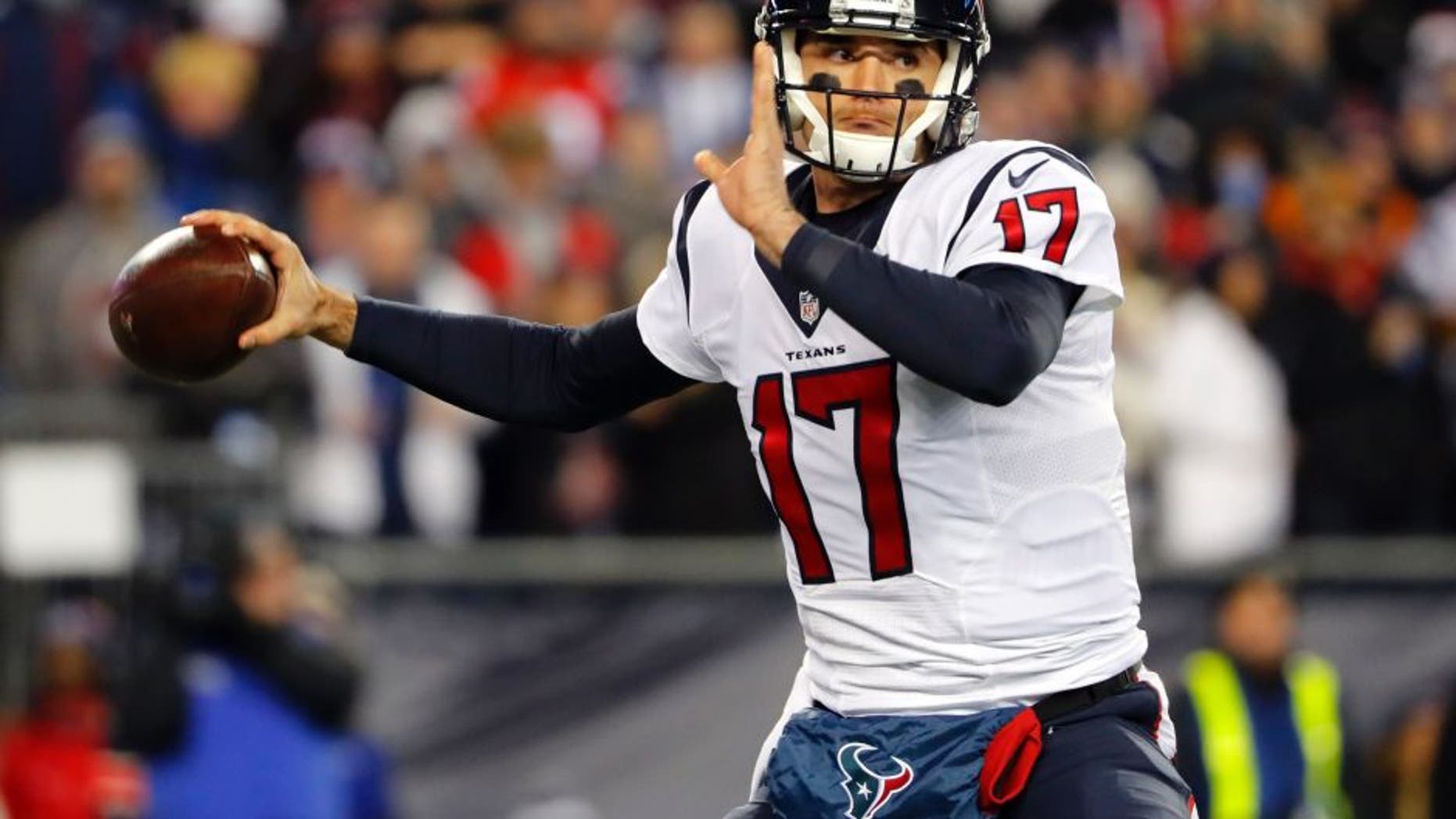 Jan 14, 2017; Foxborough, MA, USA; Houston Texans quarterback Brock Osweiler (17) drops back to pass against the New England Patriots during the first half in the AFC Divisional playoff game at Gillette Stadium. Mandatory Credit: Winslow Townson-USA TODAY Sports
