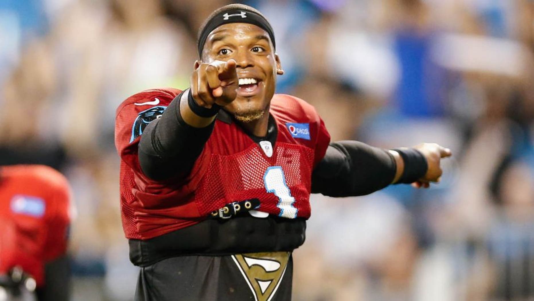 Aug 5, 2016; Charlotte, NC, USA; Carolina Panthers quarterback Cam Newton (1) leads the fans with the wave during fanfest at Bank of America Stadium. Mandatory Credit: Jim Dedmon-USA TODAY Sports