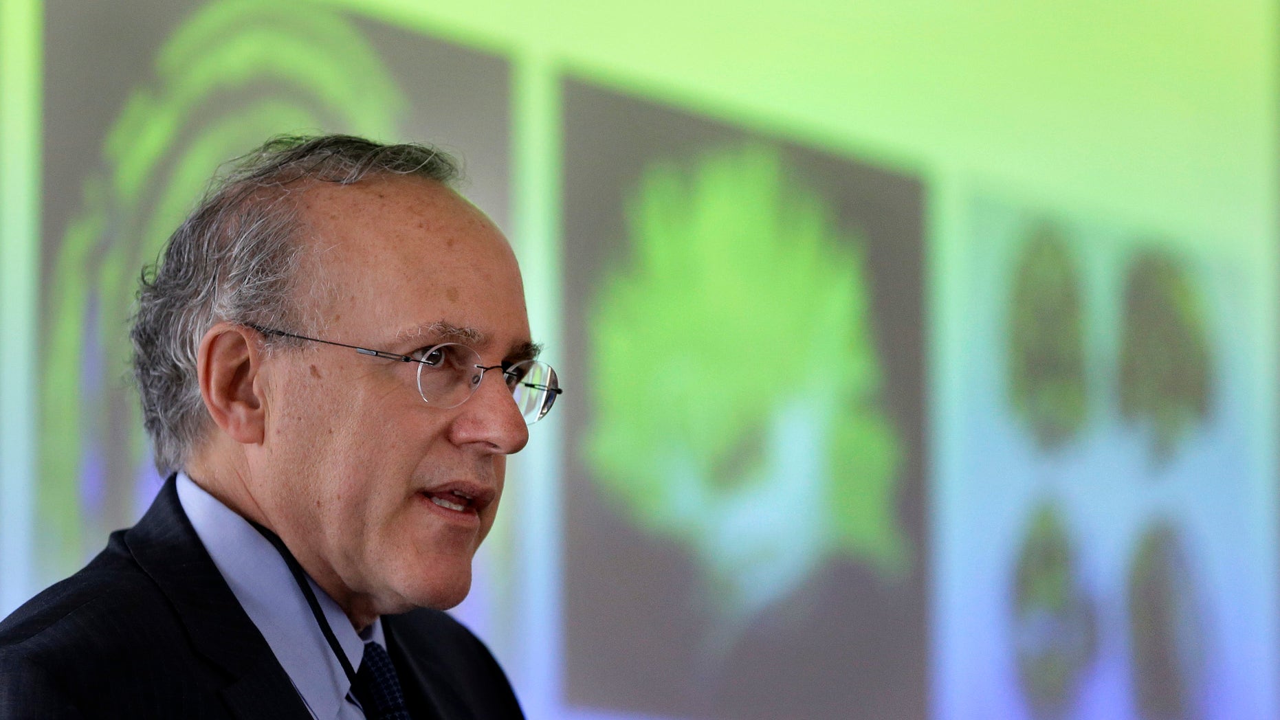 Boston University School of Medicine scientist Robert Stern stands in front of projected images of brain scans as he addresses researchers at a meeting held to launch a seven-year study into chronic traumatic encephalopathy, or CTE, at the school Wednesday, June 1, 2016, in Boston.