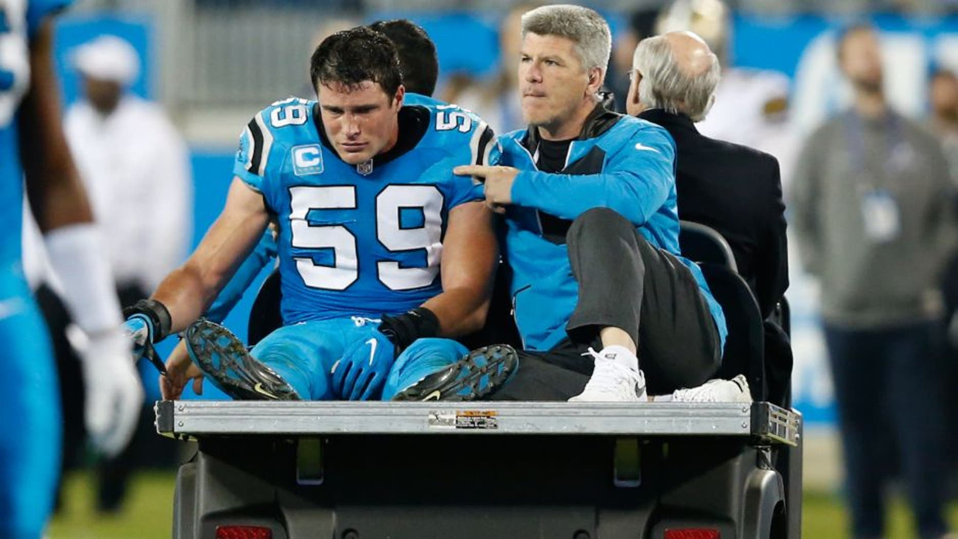 Nov 17, 2016; Charlotte, NC, USA; Carolina Panthers middle linebacker Luke Kuechly (59) rides the cart after an injury in the fourth quarter against the New Orleans Saints at Bank of America Stadium. The Panthers defeated the Saints 23-20. Mandatory Credit: Jeremy Brevard-USA TODAY Sports